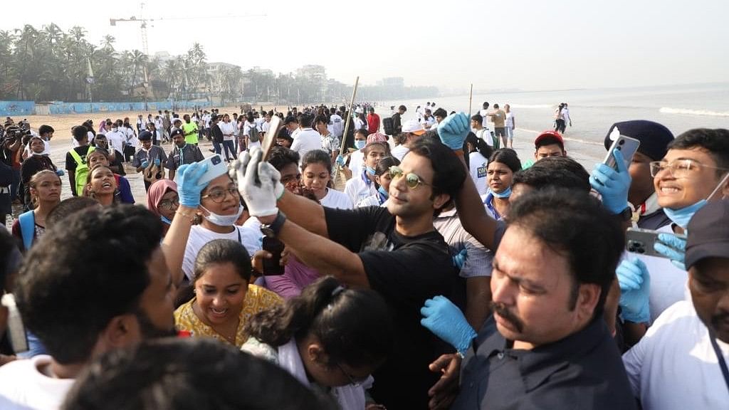 <div class="paragraphs"><p>Rajkummar Rao clicks a selfie with fans during a beach cleanup.</p></div>