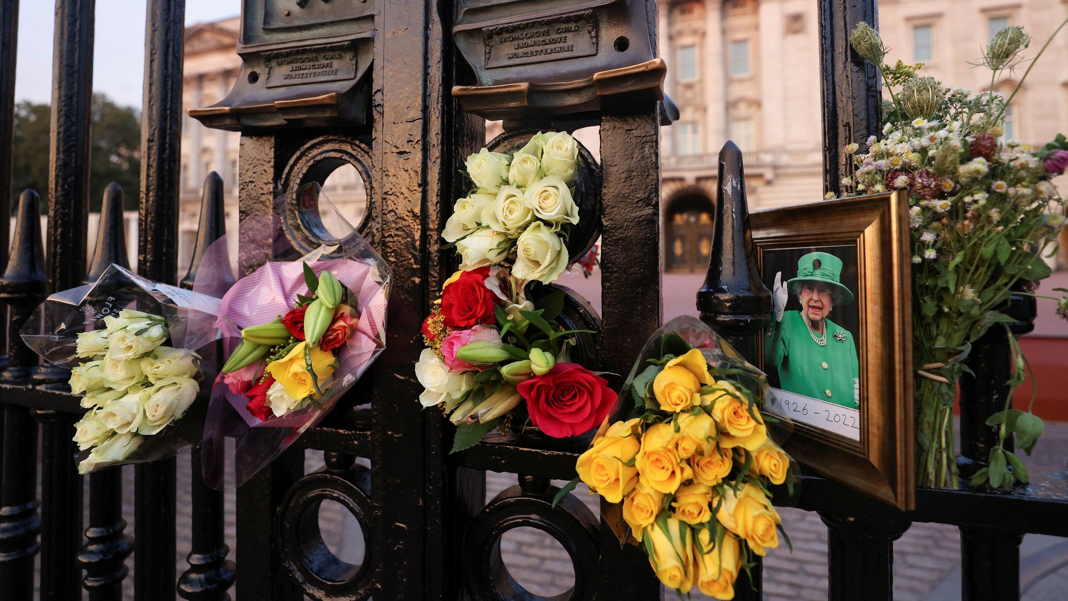 <div class="paragraphs"><p>A picture and floral tributes laid outside Buckingham Palace are seen on the first anniversary of Queen Elizabeth II's death, in London, Britain, September 8, 2023. </p></div>