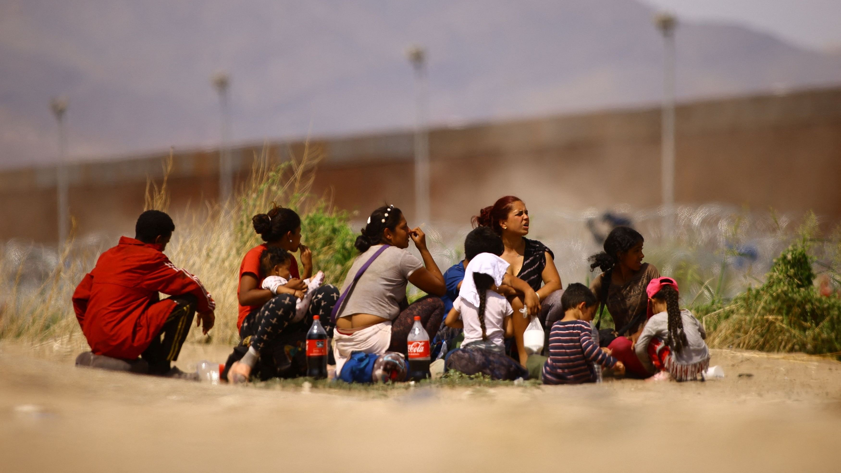<div class="paragraphs"><p>Migrants from Venezuela, seeking asylum in the United States, sit before crossing the Rio Bravo river with the intention of turning themselves in to US Border Patrol agents, as seen from Ciudad Juarez, Mexico, September 21, 2023.</p></div>
