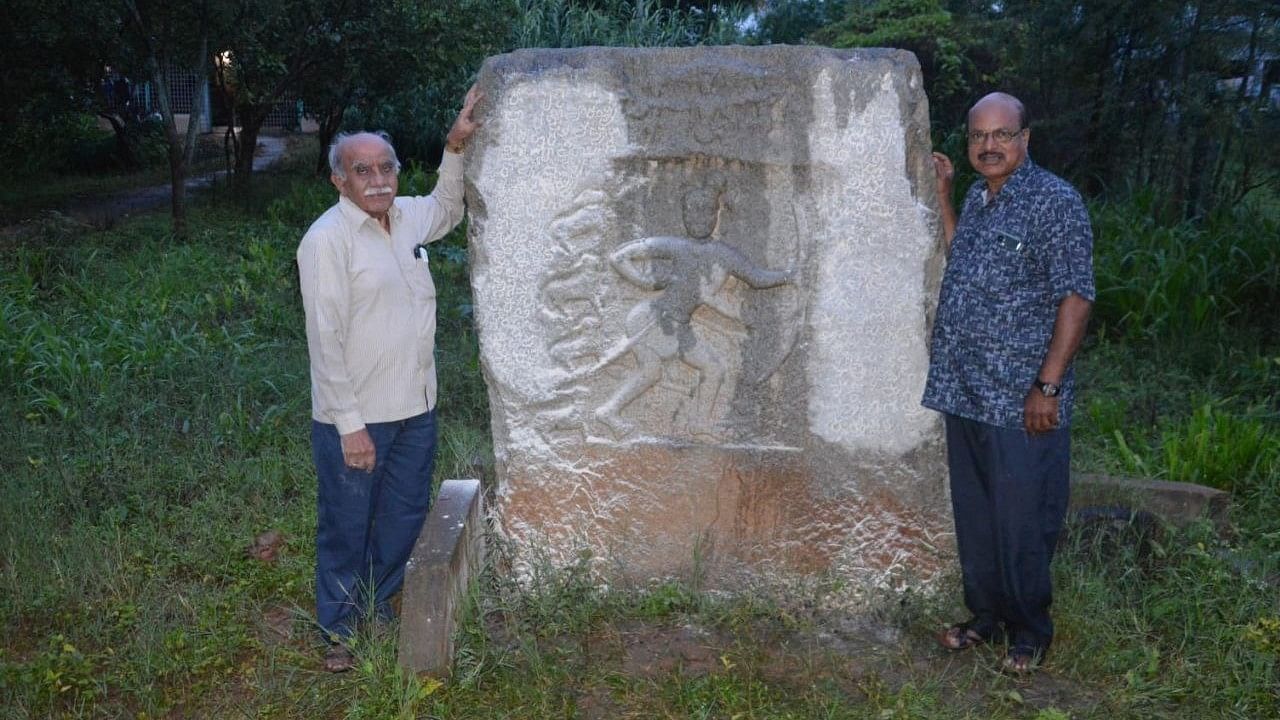 <div class="paragraphs"><p>K Dhanapal (right) and his friend K R Narasimhan found a 967 CE hero&nbsp;stone of a Rashtrakuta king near Nelamangala two months ago. </p></div>