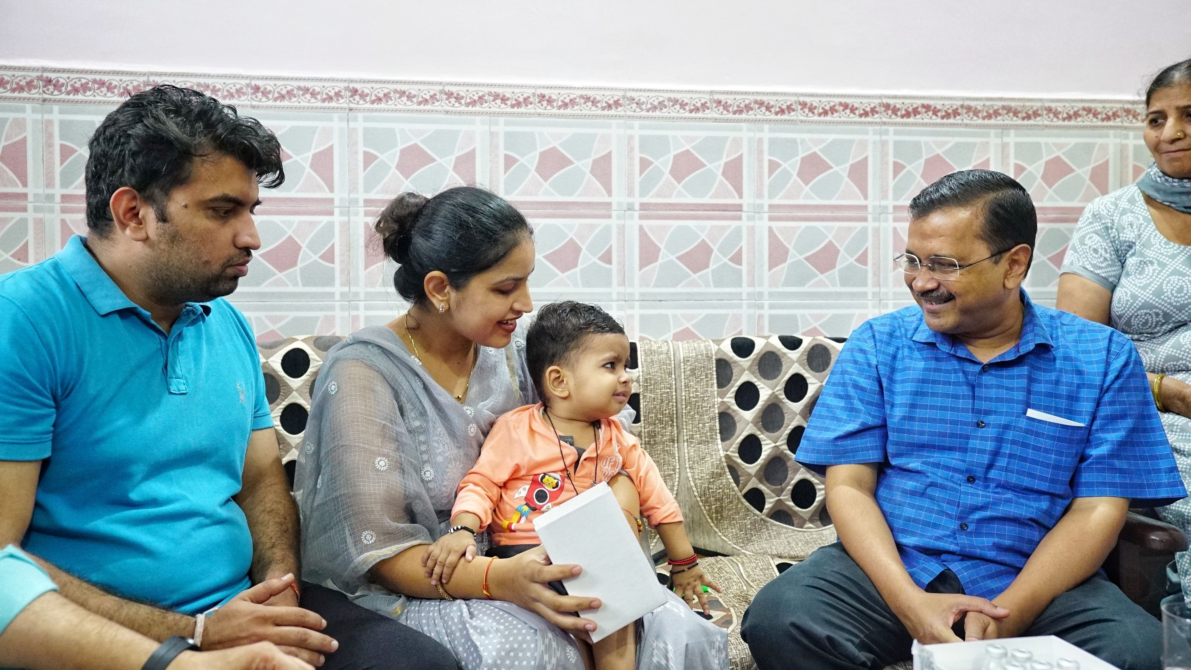 <div class="paragraphs"><p>Arvind Kejriwal with 18-month old Kanav at his Najafgarh home.&nbsp;</p></div>