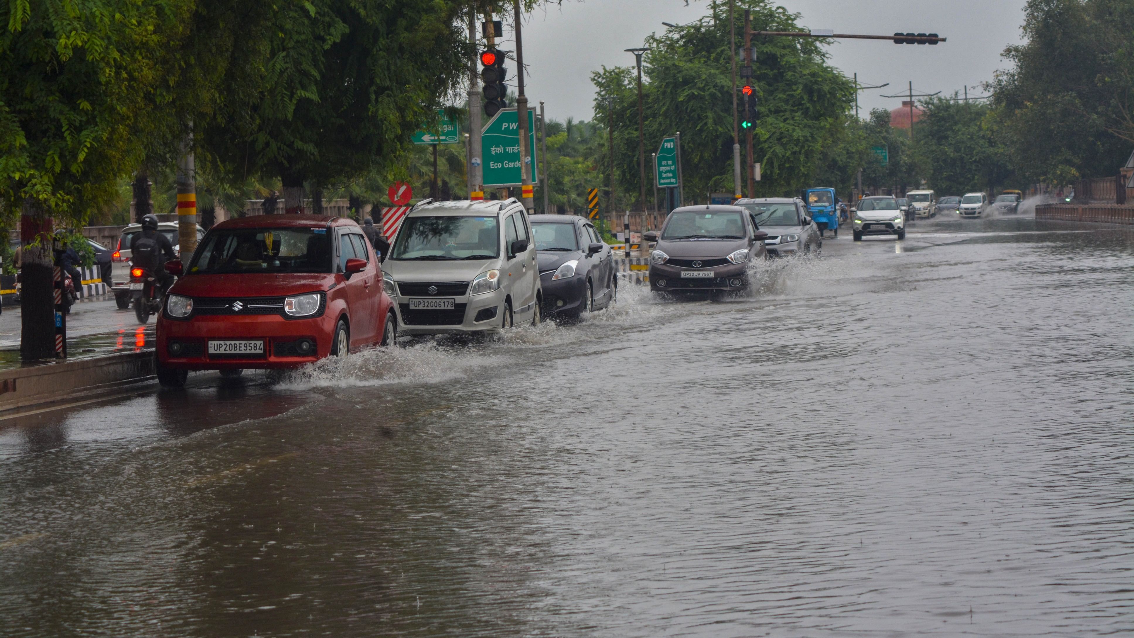 <div class="paragraphs"><p>Vehicles wade through a waterlogged road following heavy rains in Lucknow, Monday, Sept. 11, 2023.</p></div>