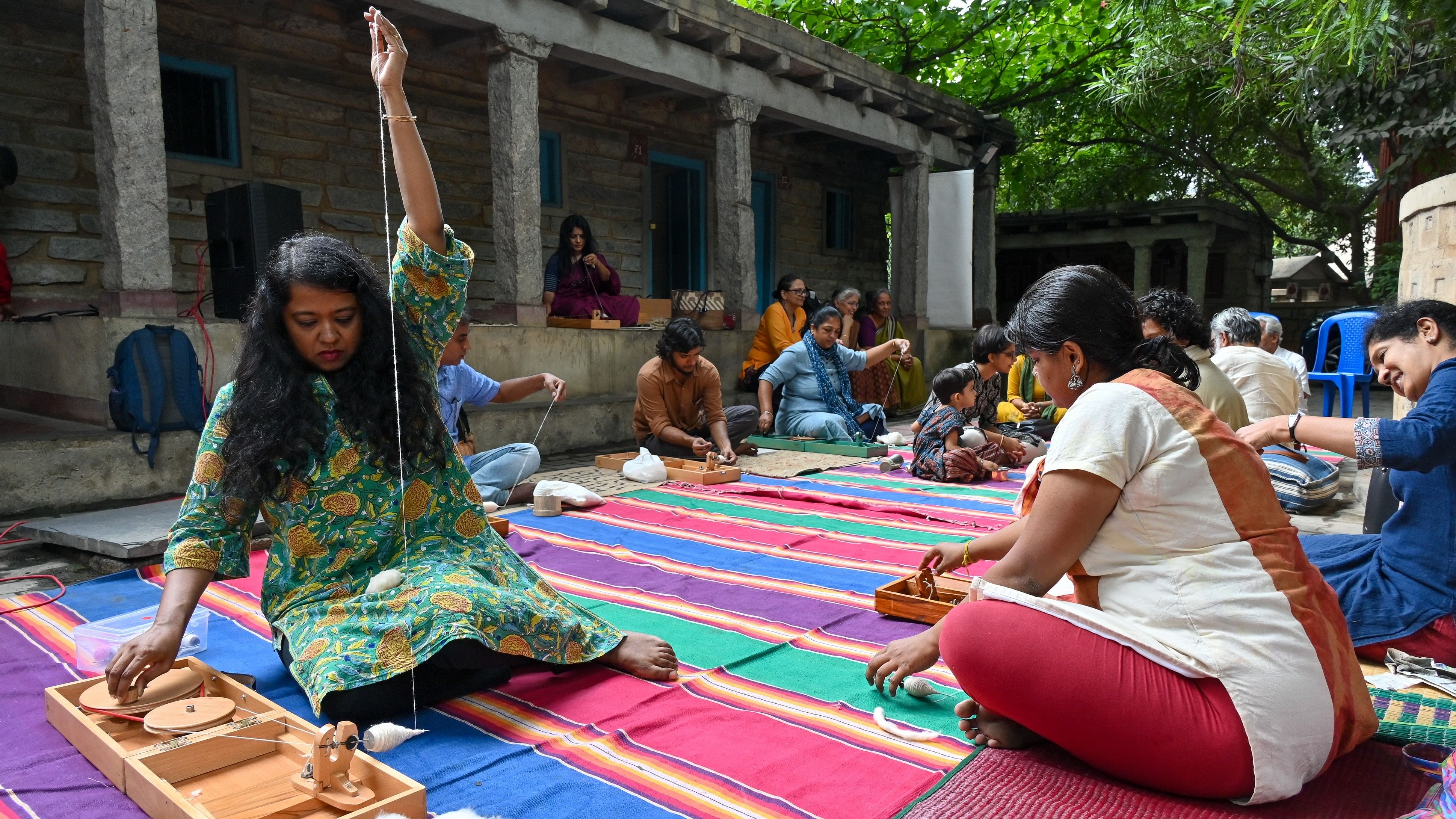 The author (in green kurta) attended charkha spinning workshops at Tvami, a handicrafts store in Bengaluru.