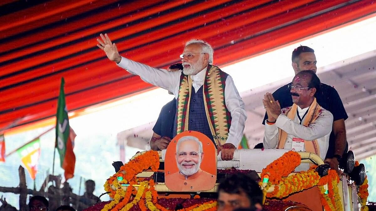 <div class="paragraphs"><p>Prime Minister Narendra Modi with Chhattisgarh BJP President Arun Sao waves at supporters as he arrives for the 'Parivartan Mahasankalp' rally, in Bilaspur, Saturday, Sept. 30, 2023.</p></div>