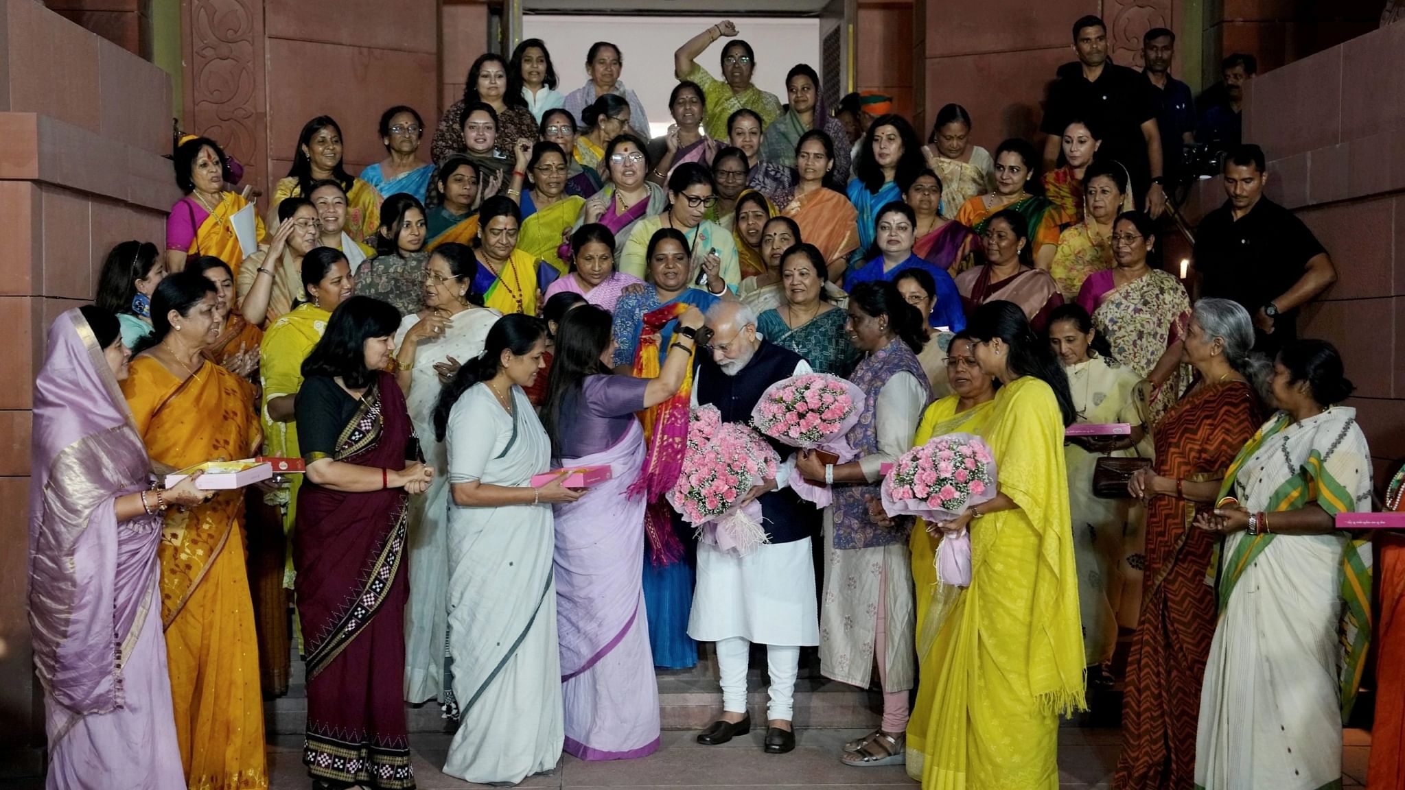 <div class="paragraphs"><p>Women MPs felicitate PM Modi while celebrating the on the historic passage of Nari Shakti Vandan Adhiniyam (women's reservation bill) by the Rajya Sabha in the special session of the Parliament.</p></div>