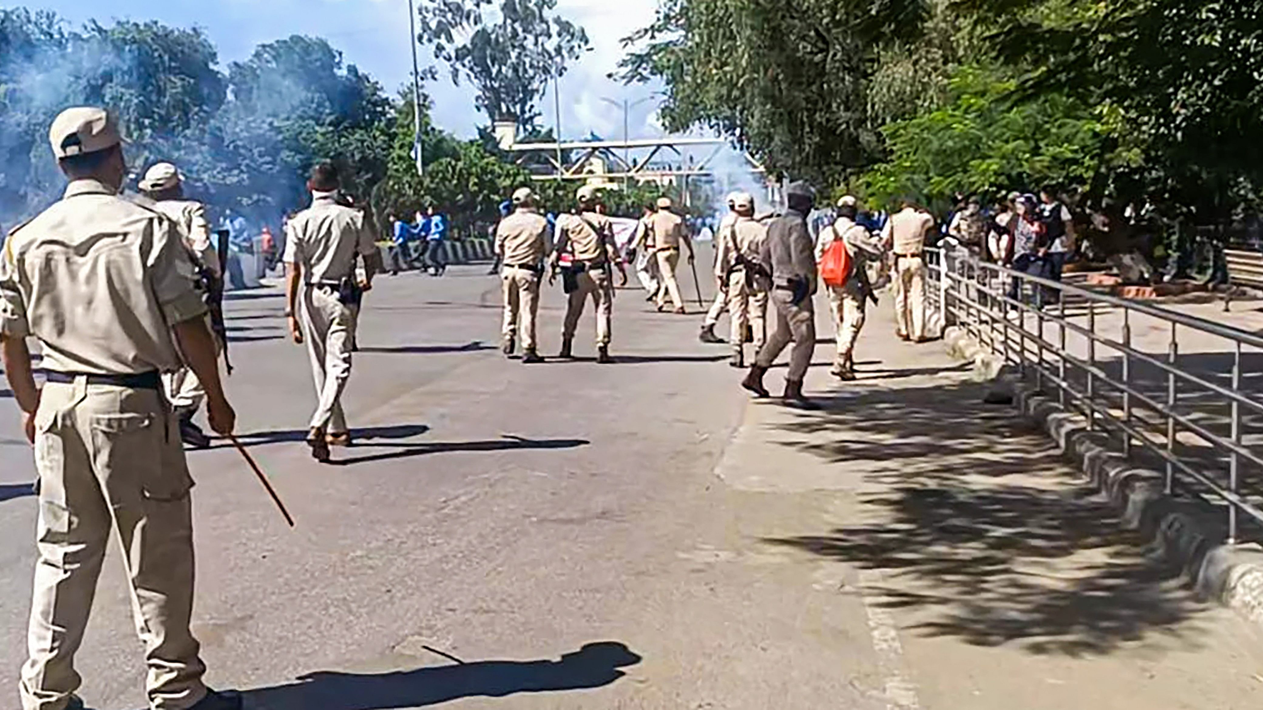 <div class="paragraphs"><p>Security personnel stand guard during a protest against the killing of two youths who were allegedly kidnapped in July, in Imphal, Tuesday, Sept. 26, 2023.</p></div>