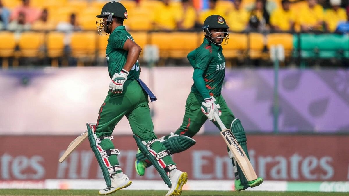 <div class="paragraphs"><p>Bangladesh's batter Najmul Hossain Shanto and Mushfiqur Rahim run between the wickets during aICC Men's World Cup 2023 match.</p></div>