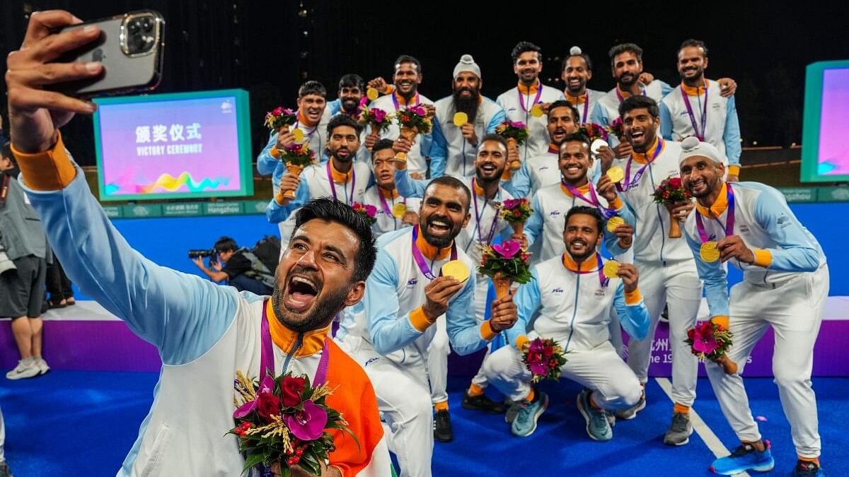 <div class="paragraphs"><p>Indian players celebrate after winning the gold medal in the men's hockey event at the 19th Asian Games, in Hangzhou, China.</p></div>