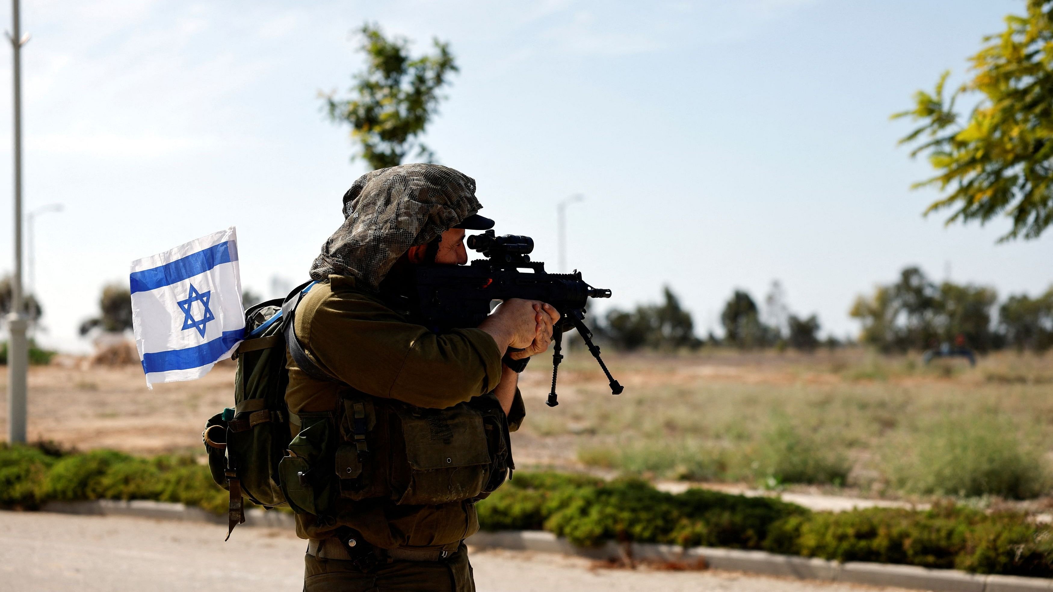 <div class="paragraphs"><p>An Israeli soldier secures an area, following a deadly infiltration by Hamas gunmen from the Gaza Strip, in Kibbutz Kissufim in southern Israel October 21, 2023.</p></div>