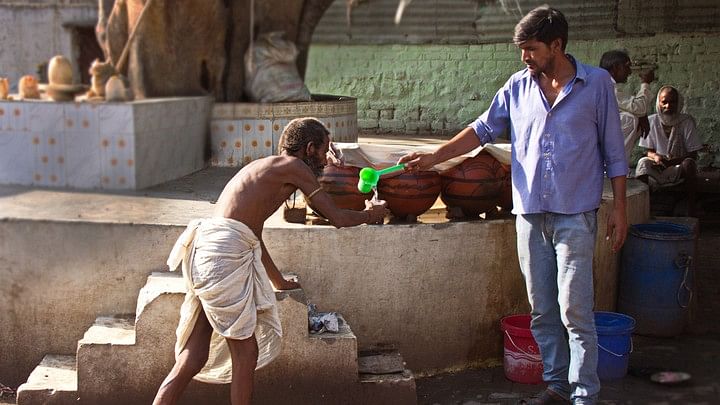 <div class="paragraphs"><p>Representative image of a Dalit man being served water from a distance.&nbsp;</p></div>