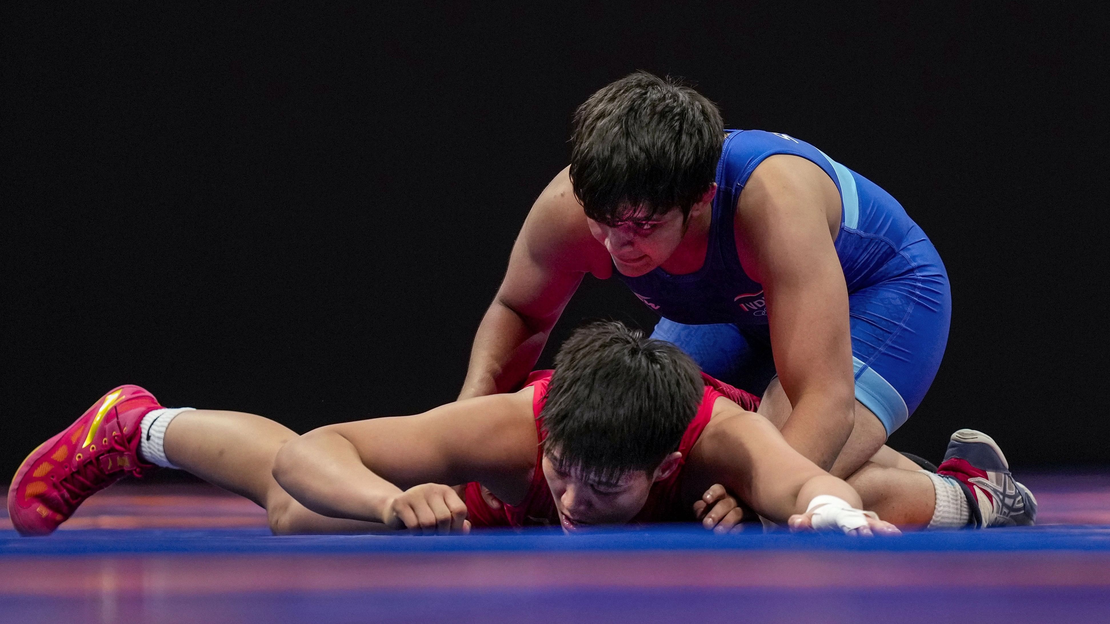 <div class="paragraphs"><p>India's Sonam (in blue) in action against China's Jia Long in the women's freestyle 62kg category wrestling  bout for the bronze medal, at the 19th Asian Games, in Hangzhou, China.</p></div>