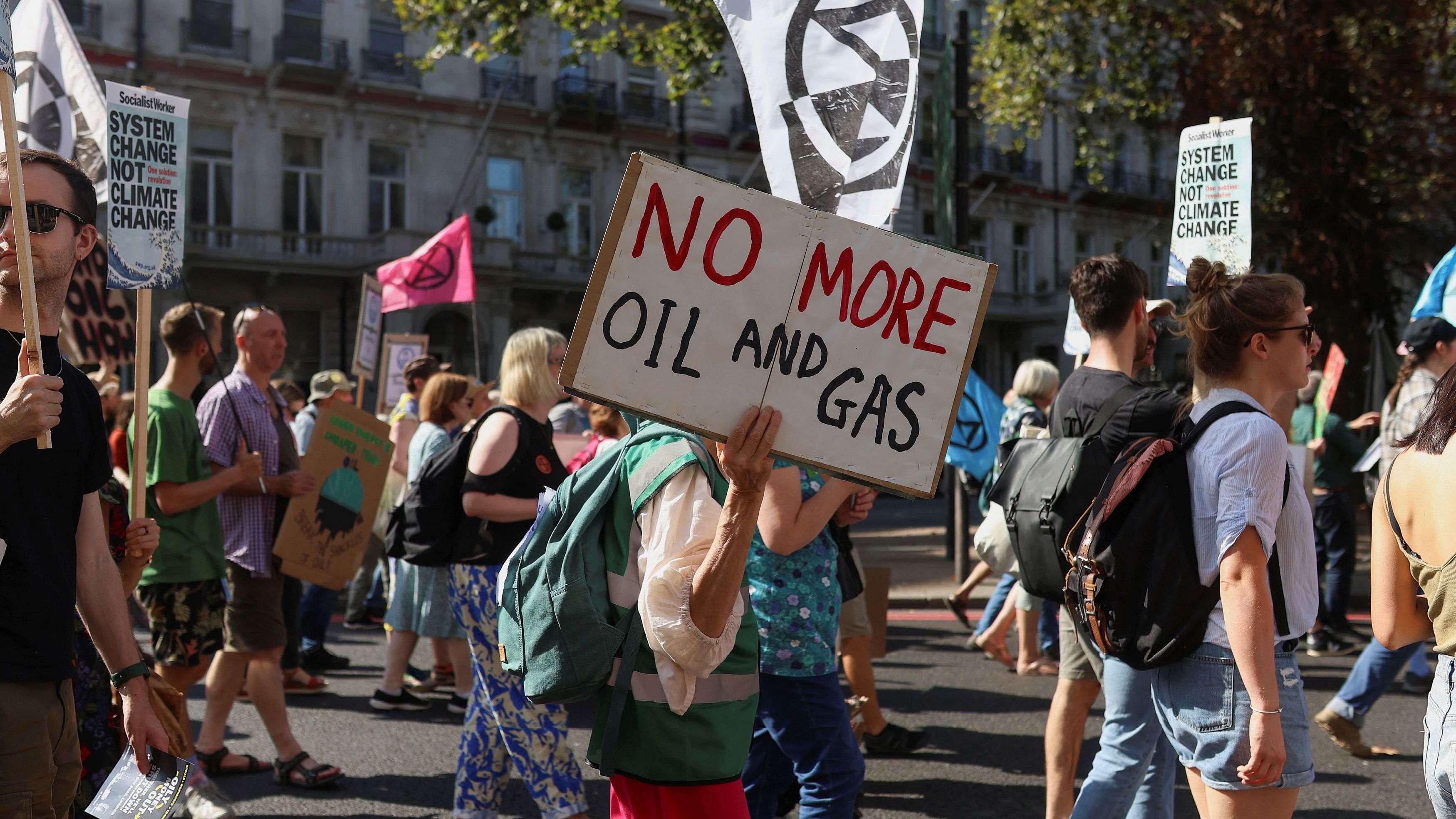 <div class="paragraphs"><p>File photo of demonstrators attending a global protest to end fossil fuels, in London. </p></div>