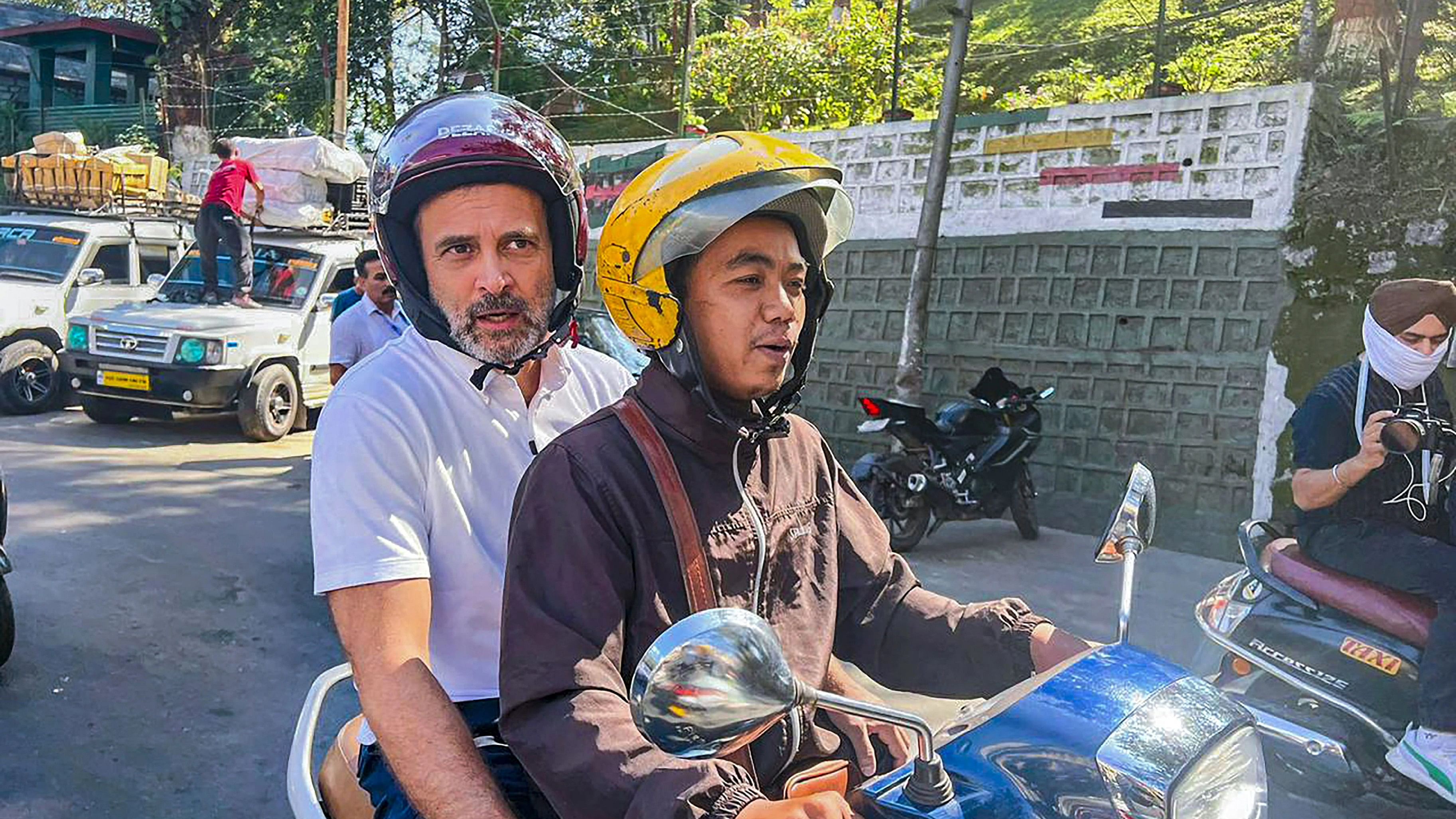 <div class="paragraphs"><p> Congress leader Rahul Gandhi rides a two-wheeler during his visit to Mizoram ahead of upcoming State Assembly elections, in Aizawl.&nbsp;</p></div>