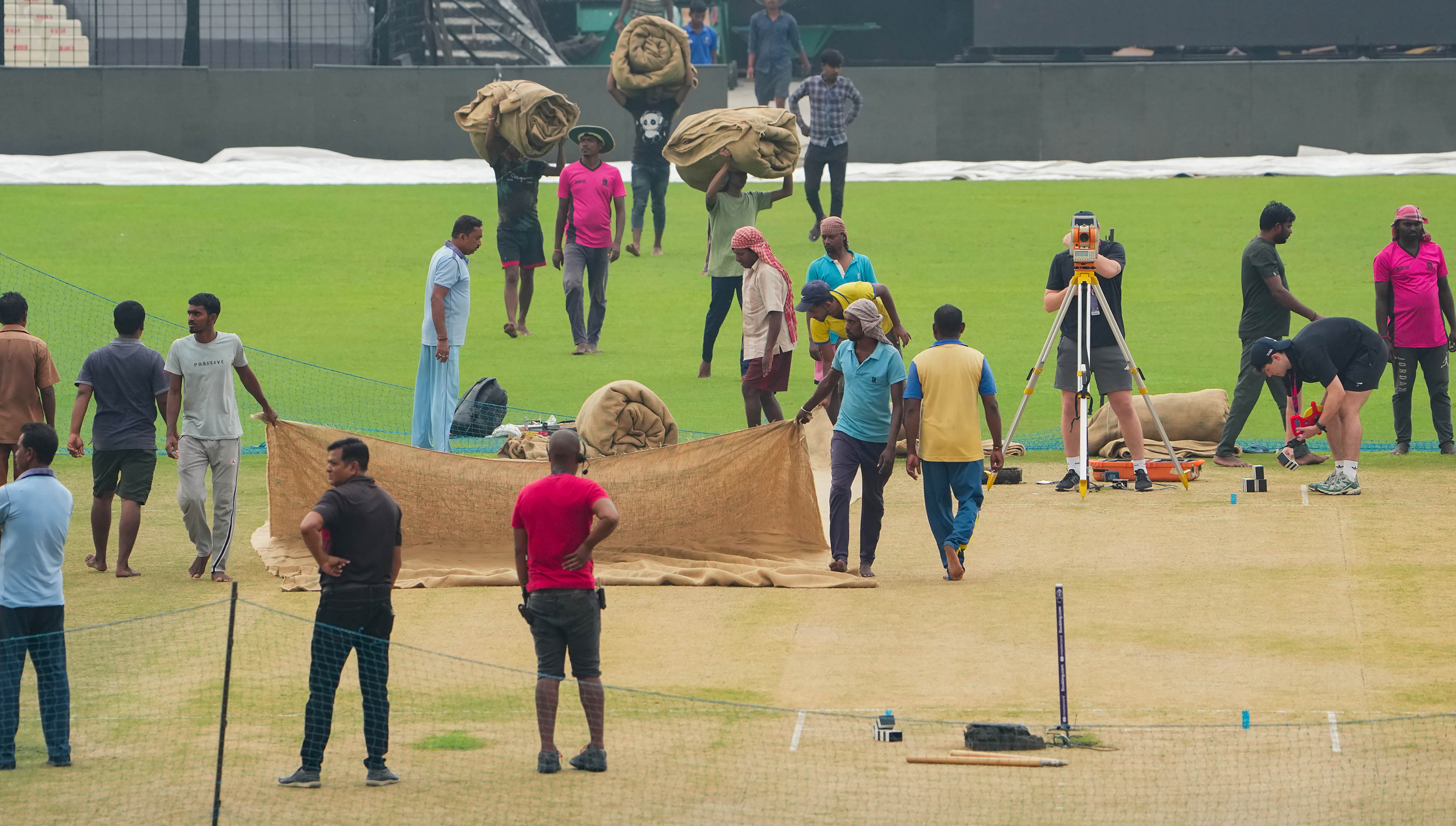 <div class="paragraphs"><p>Groundsmen cover the pitch on the eve of the ICC Men's Cricket World Cup 2023 match between Bangladesh and Netherlands, at Eden Gardens in Kolkata, Friday, Oct. 27, 2023.</p></div>