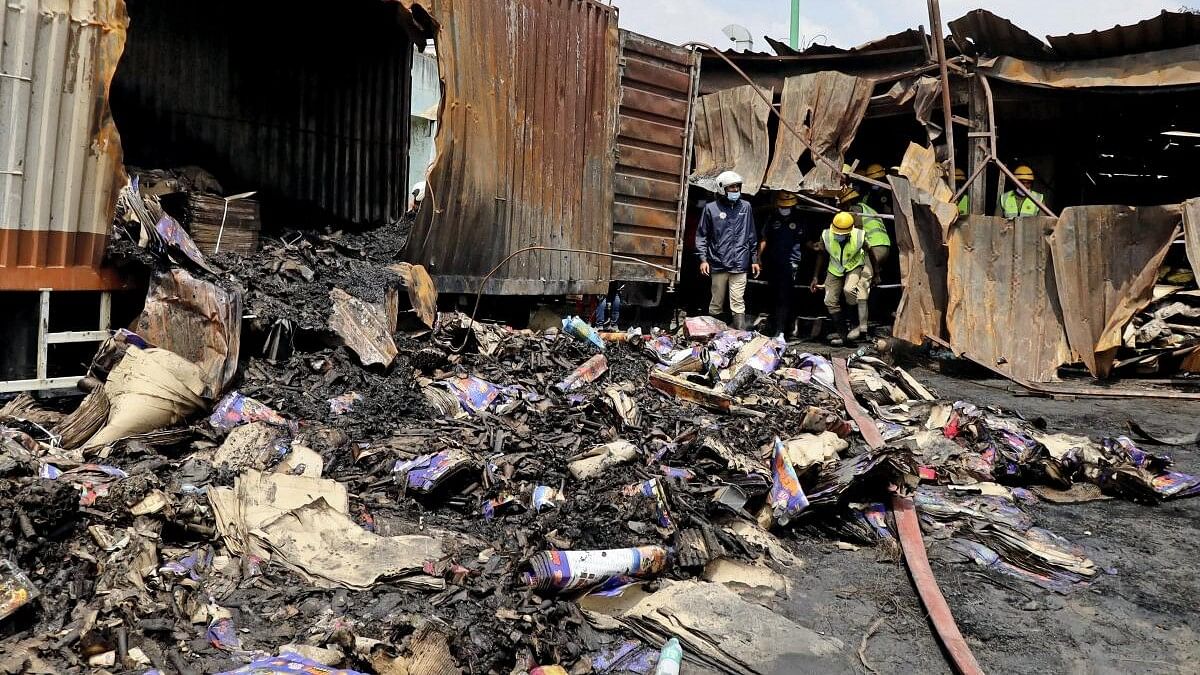 <div class="paragraphs"><p>SDRF personnel at the site where a firecracker shop-cum-godown caught fire on Saturday, at Attibele in Bengaluru district, Sunday, Oct. 8, 2023.</p></div>