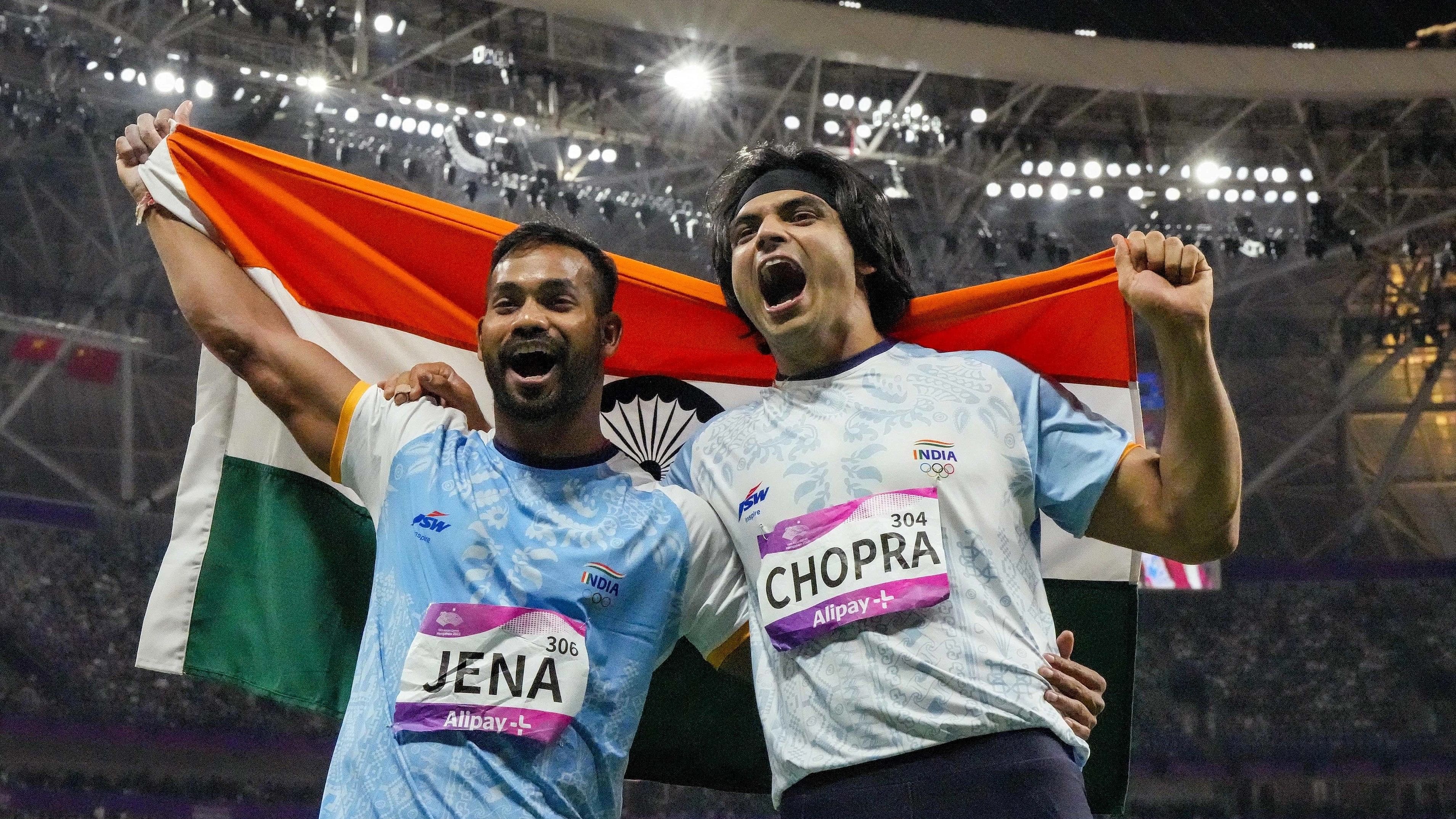 <div class="paragraphs"><p>Indian athletes Neeraj Chopra and Kishore Kumar Jena celebrate after securing gold and silver medals respectively in the Men's Javelin Throw Final event at the 19th Asian Games, in Hangzhou, China, Wednesday, Oct. 4, 2023.   </p></div>