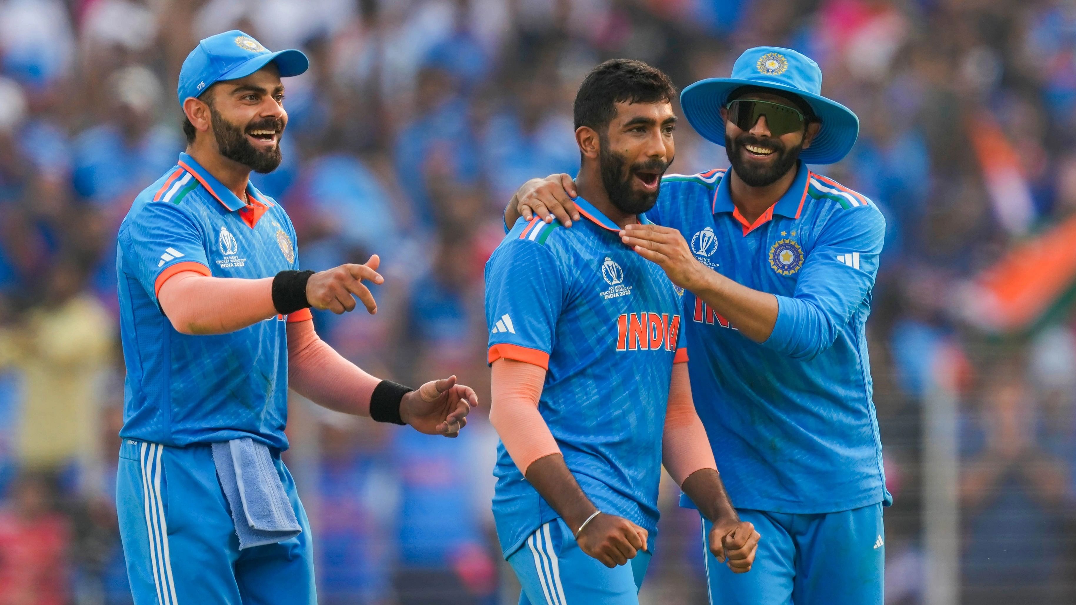 <div class="paragraphs"><p>India's Jasprit Bumrah with Virat Kohli and Ravindra Jadeja celebrates the wicket of Pakistan's Mohammad Rizwan during the ICC Men's Cricket World Cup 2023.</p></div>