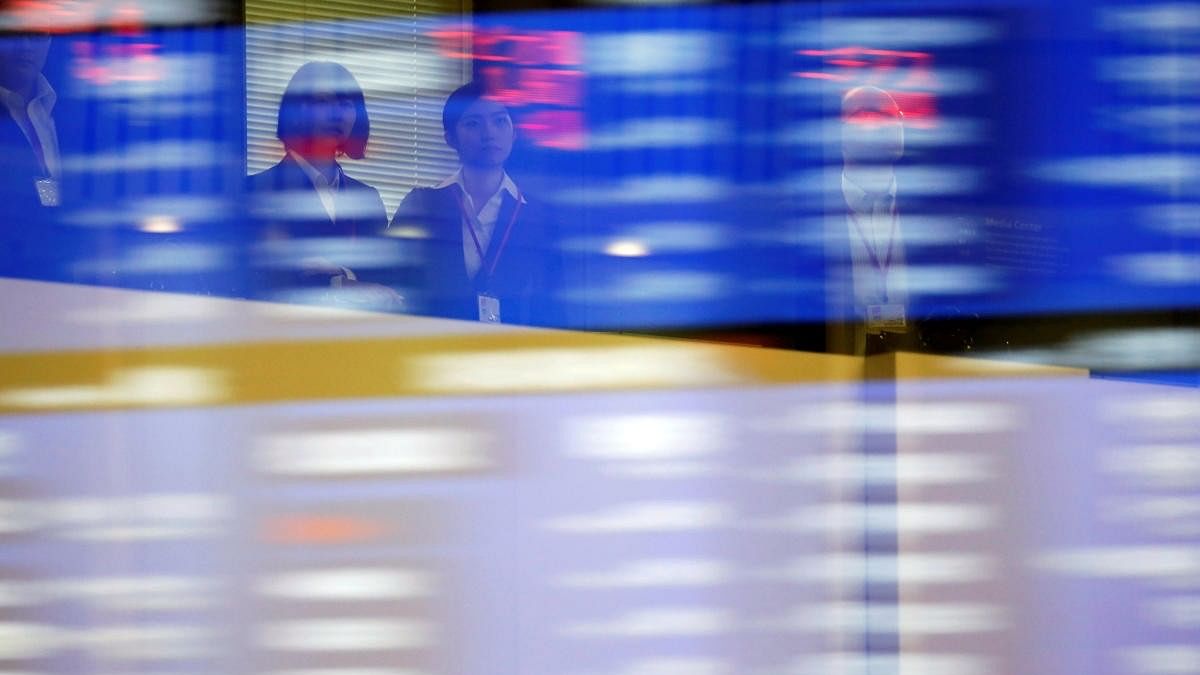 <div class="paragraphs"><p>Visitors are seen as market prices are reflected in a glass window at the Tokyo Stock Exchange (TSE) in Tokyo, Japan.</p></div>