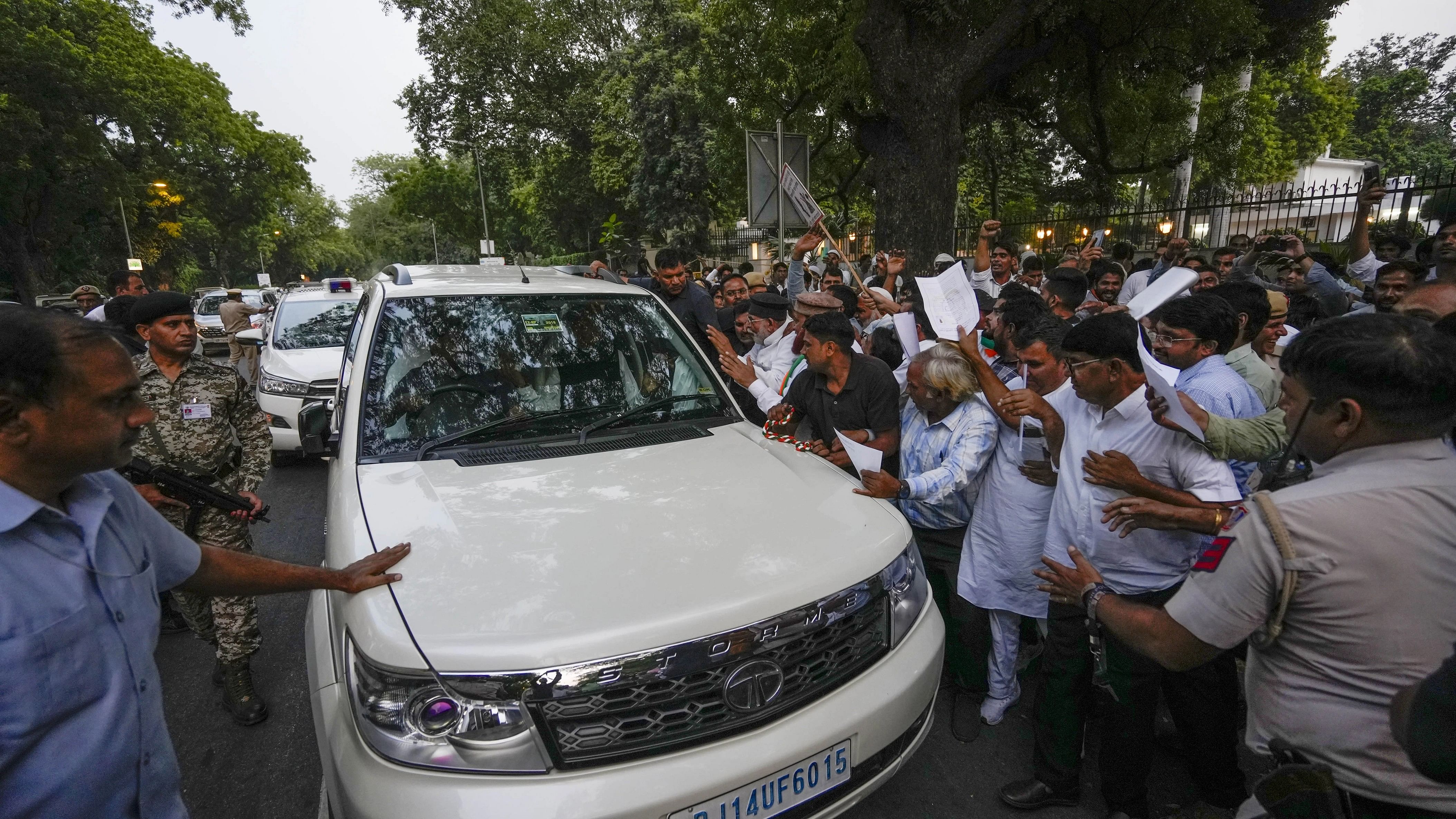 <div class="paragraphs"><p>Rajasthan Chief Minister Ashok Gehlot being surrounded by ticket seekers and supporters, ahead of the upcoming State Assembly elections, as he leaves from Jodhpur House, in New Delhi, Sunday, Oct. 15, 2023.</p></div>