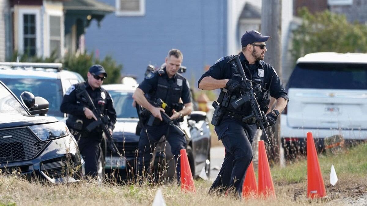 <div class="paragraphs"><p>Members of law enforcement arrive at a farm, as the search for the suspect in the deadly mass shootings in Lewiston continues, in Lisbon Falls, Maine</p></div>