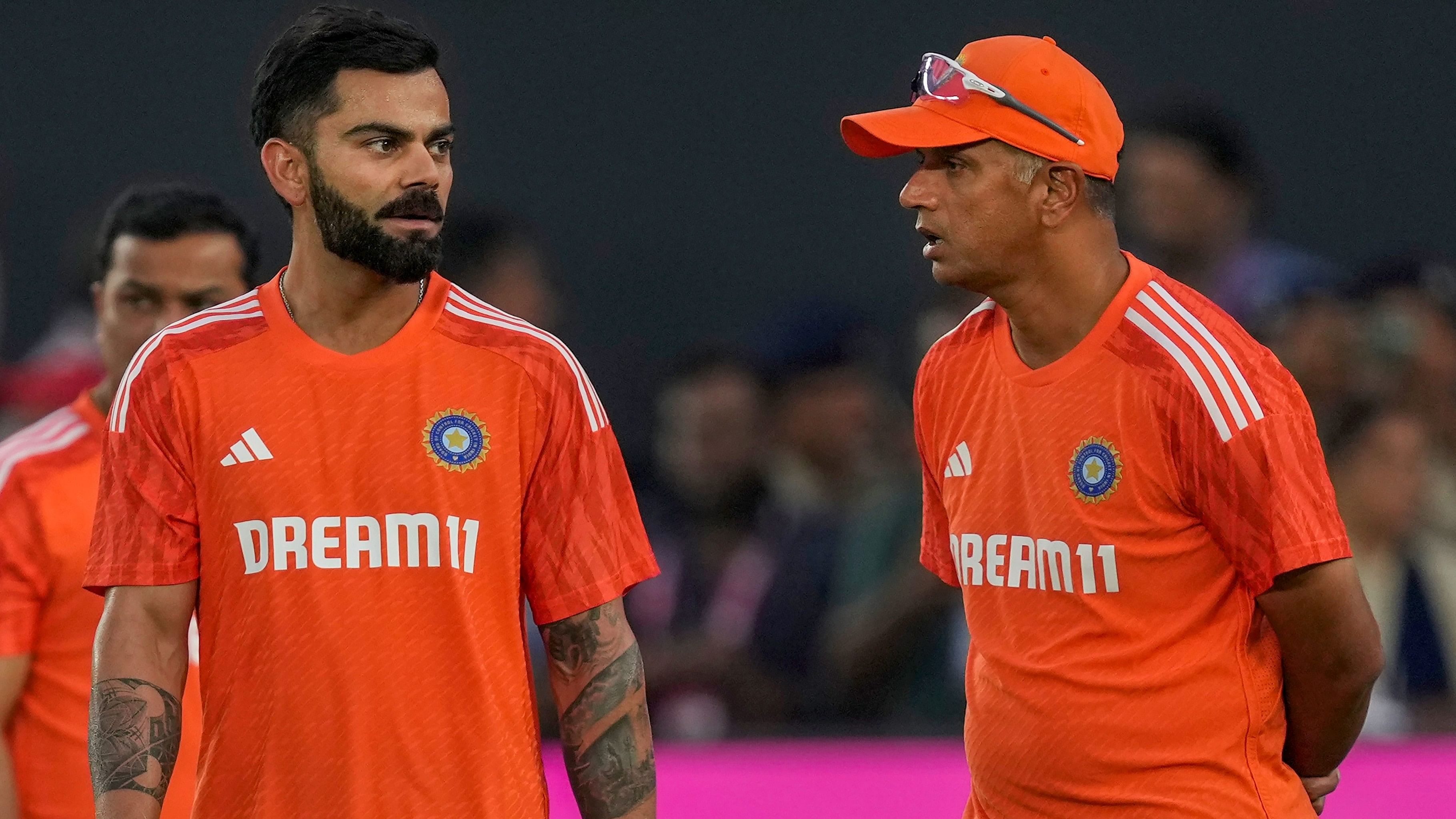 <div class="paragraphs"><p>India’s coach Rahul Dravid with Virat Kohli during a practice session ahead of the World match between India and Pakistan at Narendra Modi Stadium in Ahmedabad on Friday. </p></div>