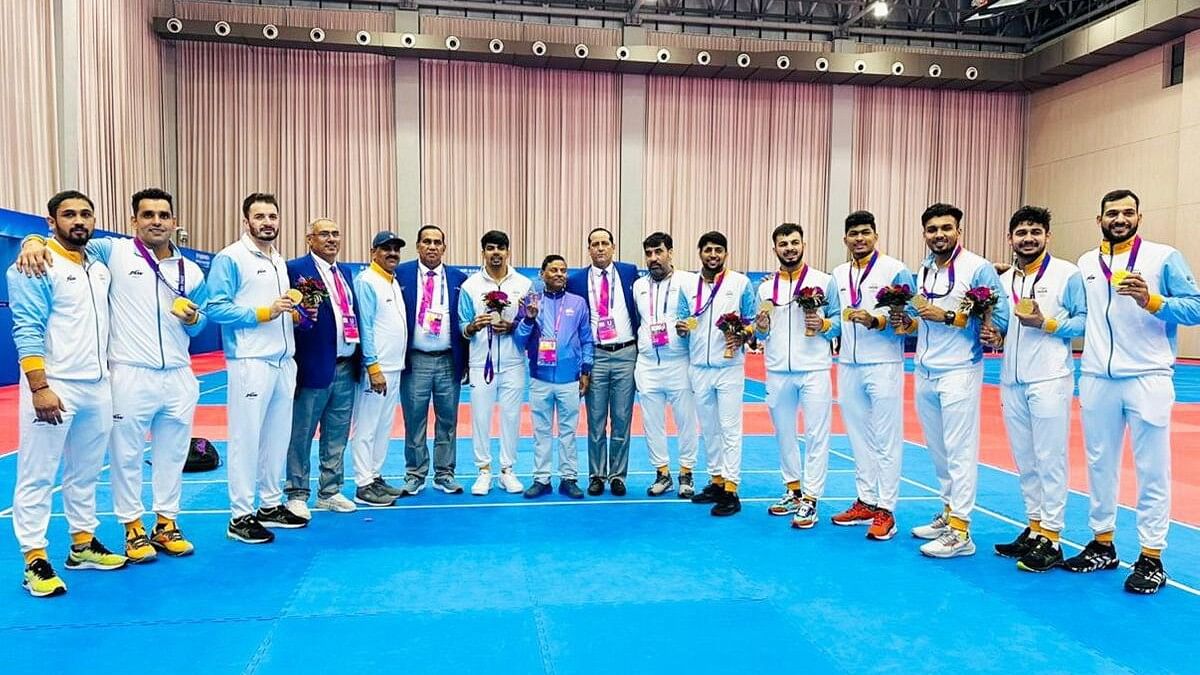 <div class="paragraphs"><p>Gold medallist Indian players with officials pose for photos after the men's kabaddi event at the 19th Asian Games, in Hangzhou.</p></div>