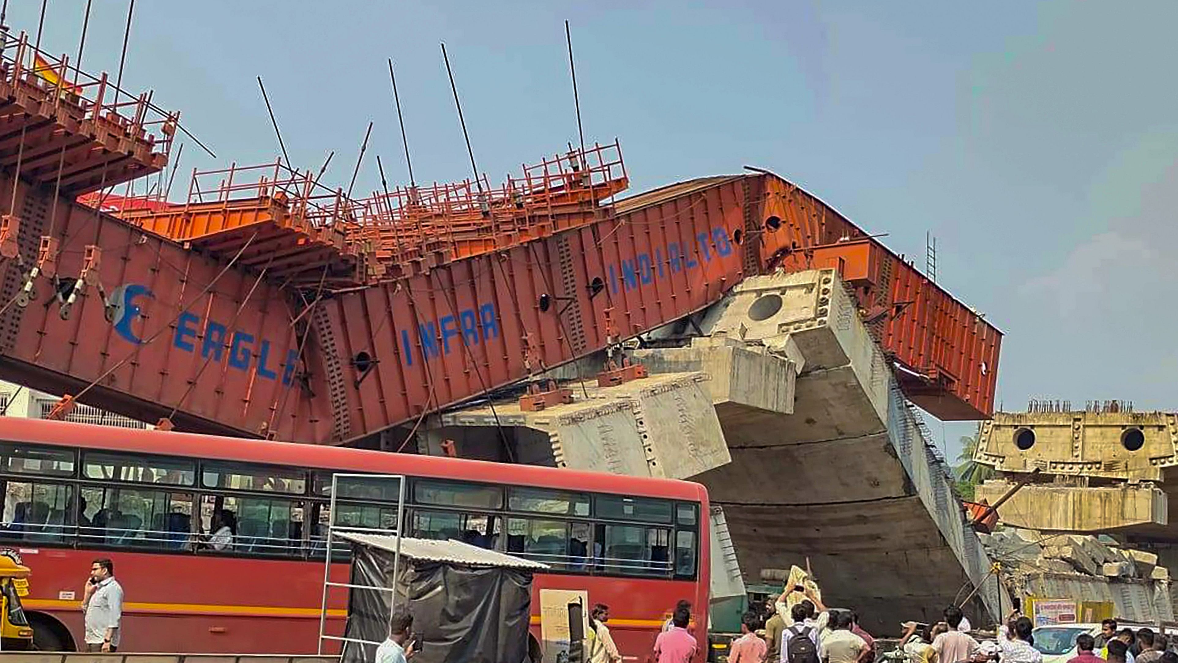 <div class="paragraphs"><p> Locals at the site after an under-construction flyover on the Mumbai-Goa highway collapsed, at Chiplun in Ratnagiri district, Maharashtra.</p></div>