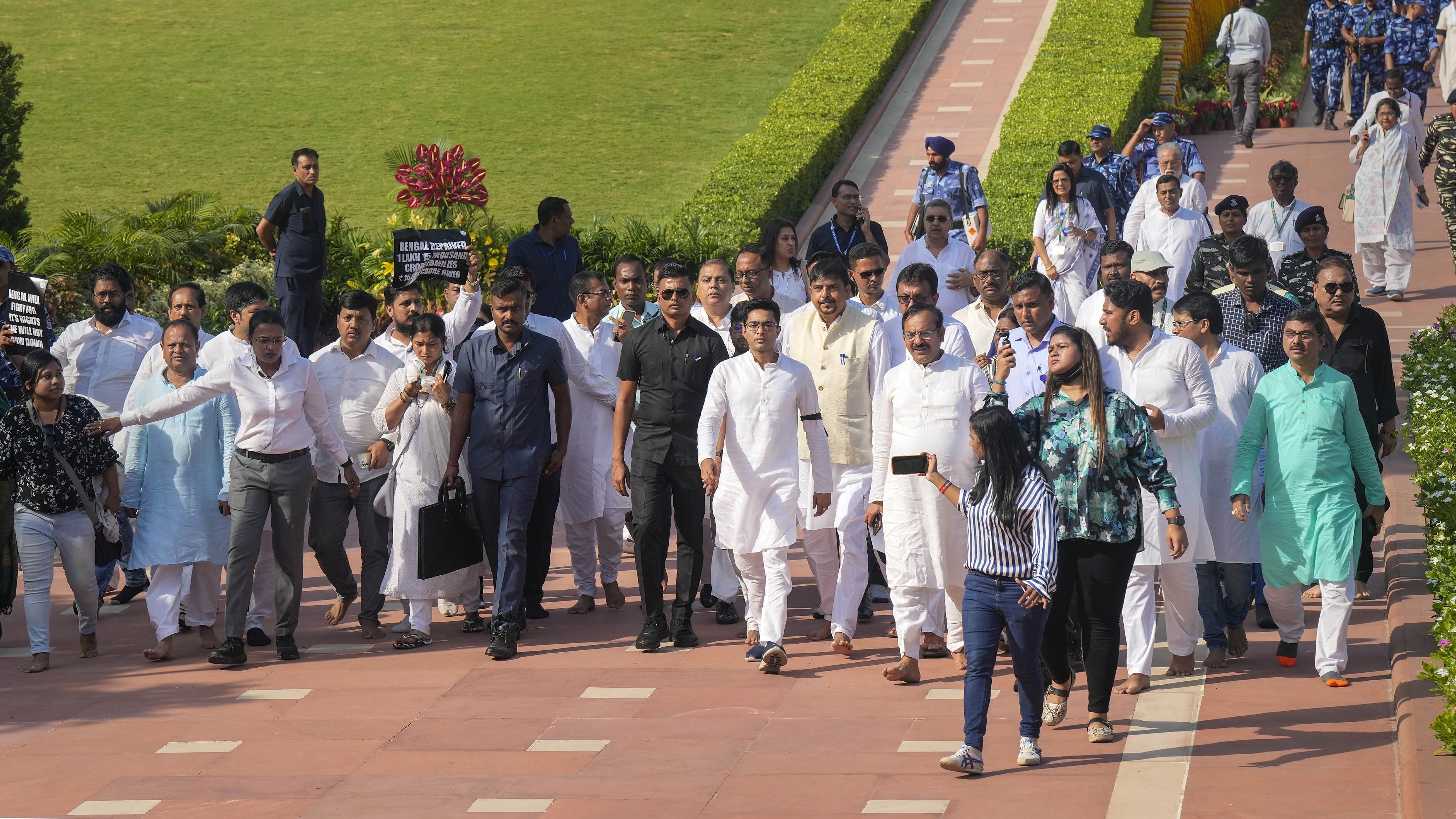 <div class="paragraphs"><p>TMC National General Secretary Abhishek Banerjee with party leaders leaves after party's protest against the central government at Rajghat, in New Delhi, Monday, Oct. 2, 2023.</p></div>