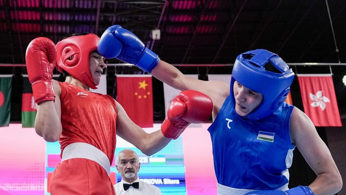 <div class="paragraphs"><p>Parveen Hooda (red) competes against Uzbekistan’s Sitora Turdibekova in the Women’s 54-57kg Boxing Quarterfinal match at the 19th Asian Games, in Hangzhou, China, Sunday, Oct. 1, 2023.</p></div>