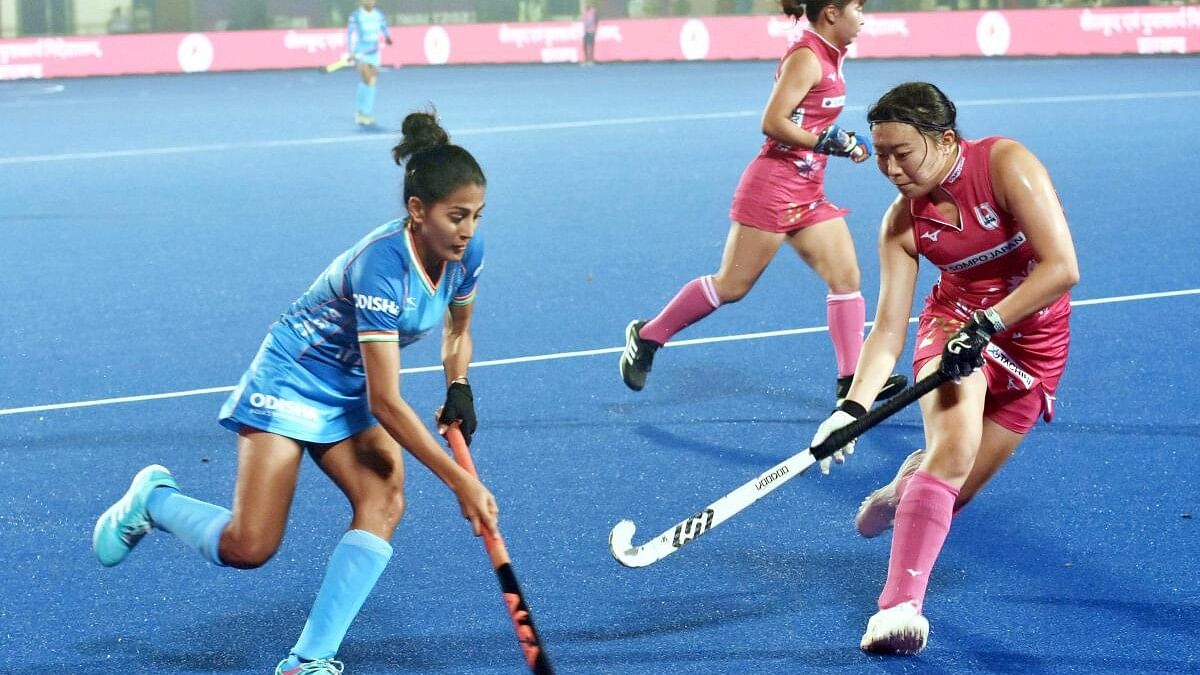 <div class="paragraphs"><p>Players of India (in blue) and Japan vie for the ball during their Women's Asian Champions Trophy 2023 match, at Marang Gomke Jaipal Singh Astro Turf Hockey Stadium in Ranchi. </p></div>