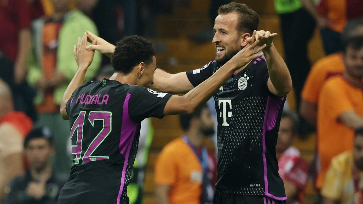 <div class="paragraphs"><p>Harry Kane (right) celebrates with Jamal Musiala (left).</p></div>