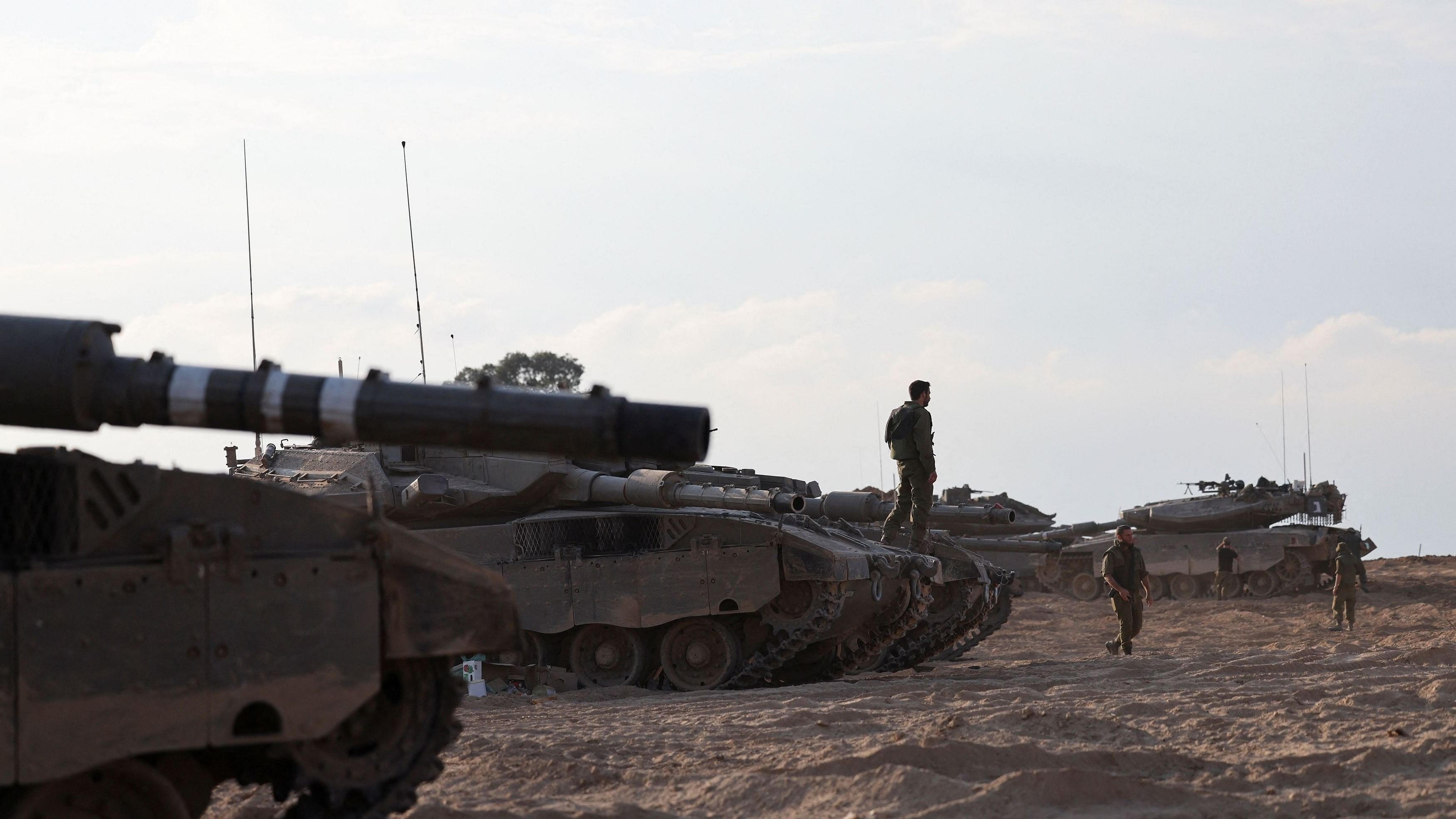 <div class="paragraphs"><p>Israeli tanks are seen in the aftermath of a mass infiltration by Hamas gunmen from the Gaza Strip, in Kibbutz Beeri in southern Israel, October 14, 2023.</p></div>