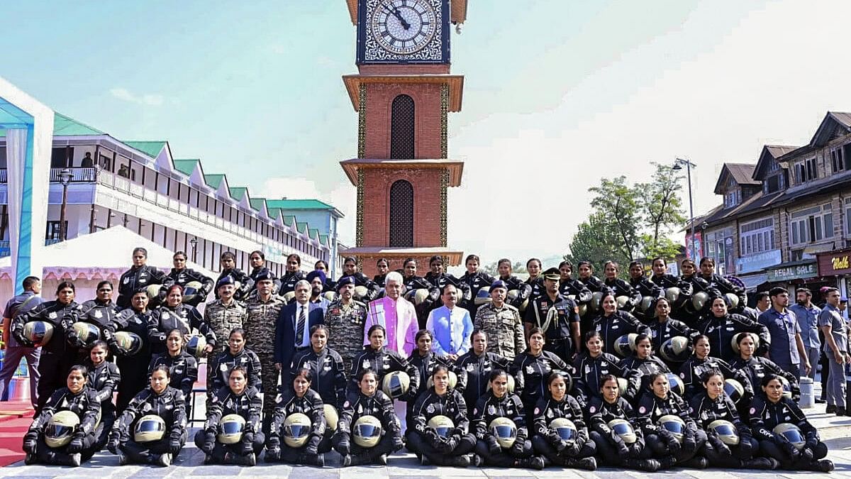 <div class="paragraphs"><p>Jammu and Kashmir Lt Governor Manoj Sinha poses for a group photo during an event organised to flag off a CRPF women bike expedition ‘Yashasvini’, at Lal Chowk in Srinagar, Tuesday, Oct. 3, 2023.</p></div>