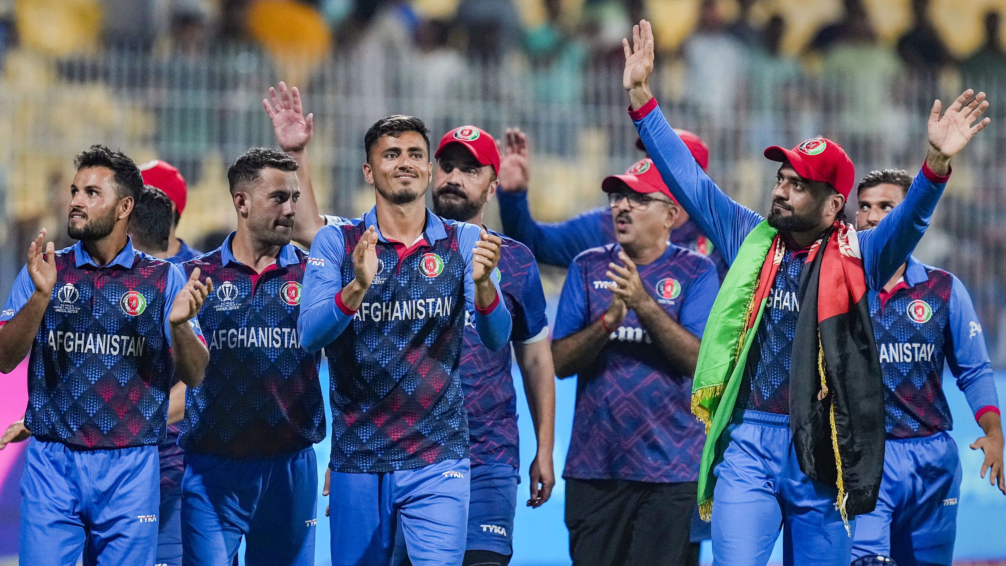 <div class="paragraphs"><p>Afghanistan players celebrate after winning the ICC Men's Cricket World Cup 2023 match against Pakistan, at MA Chidambaram Stadium in Chennai.</p></div>