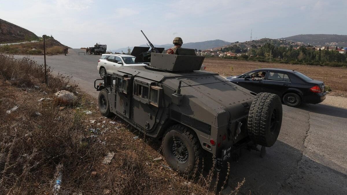 <div class="paragraphs"><p>A member of the Lebanese army sits inside a military vehicle in Khiam, near the border with Israel, in southern Lebanon October 9, 2023.</p></div>