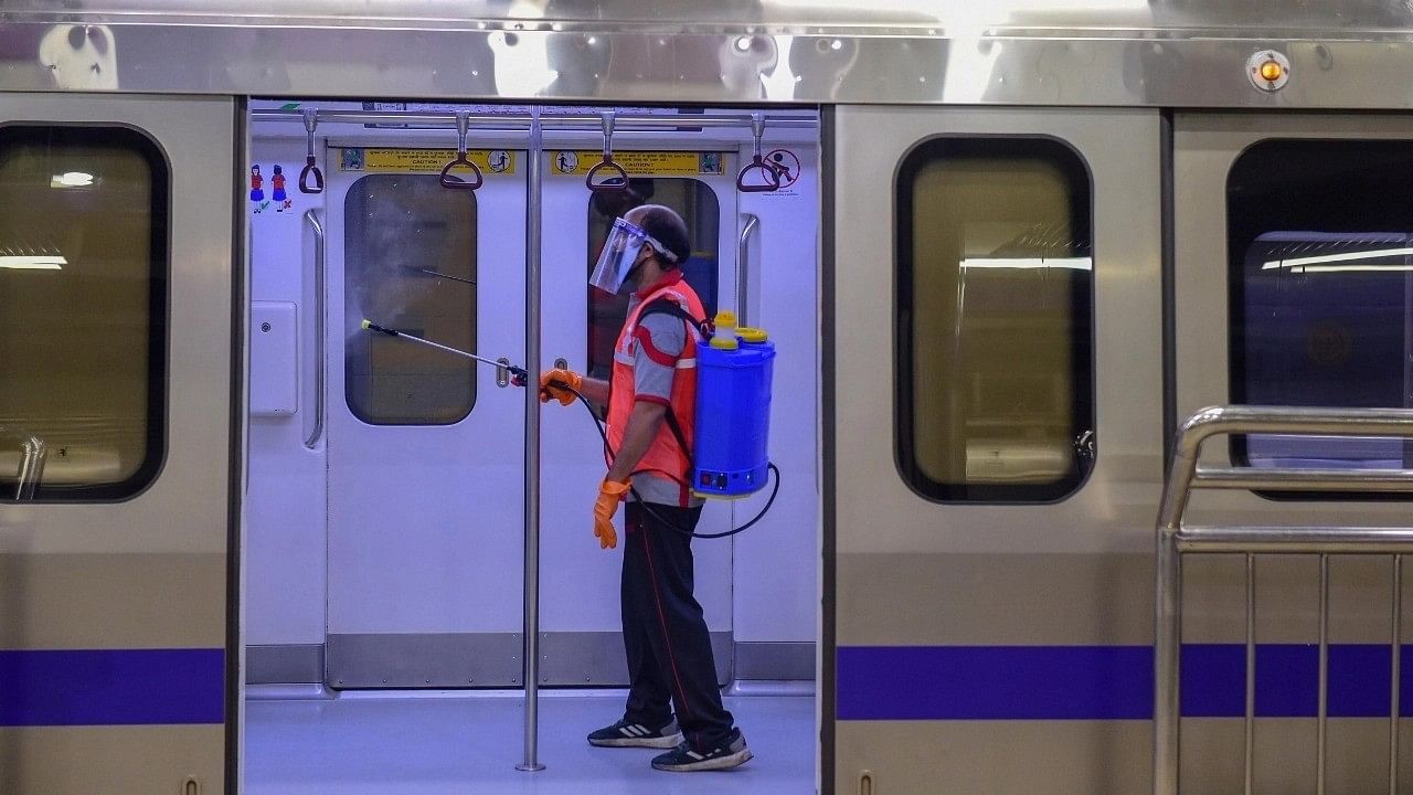 <div class="paragraphs"><p>A passenger standing inside Delhi Metro.</p></div>