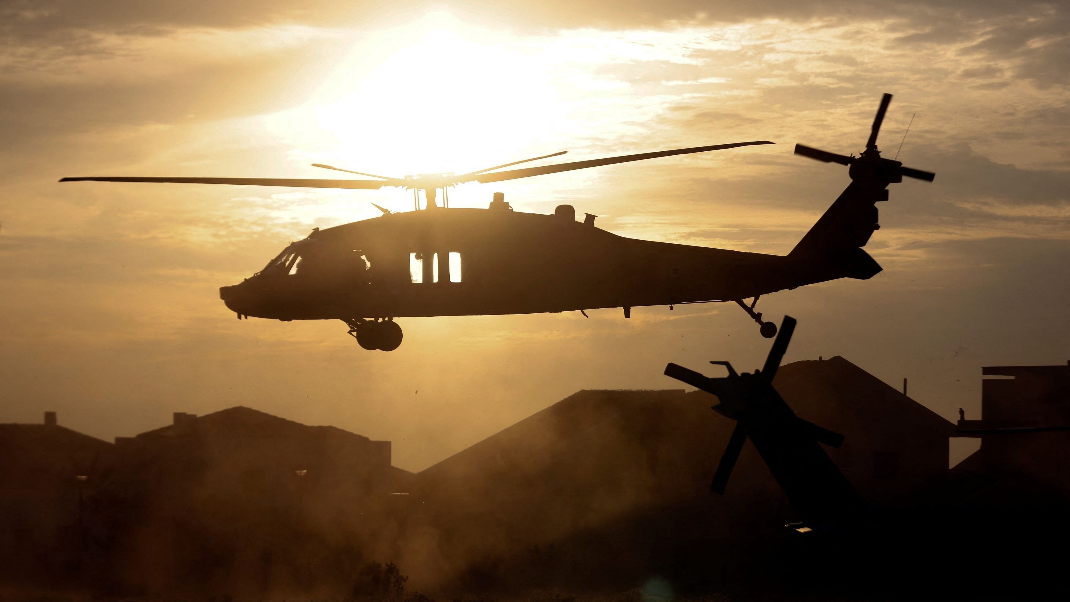 <div class="paragraphs"><p>An Israeli military helicopter is seen above a helipad at a hospital following a mass-infiltration by Hamas gunmen from the Gaza Strip, in Ashkelon, southern Israel October 7, 2023. </p></div>