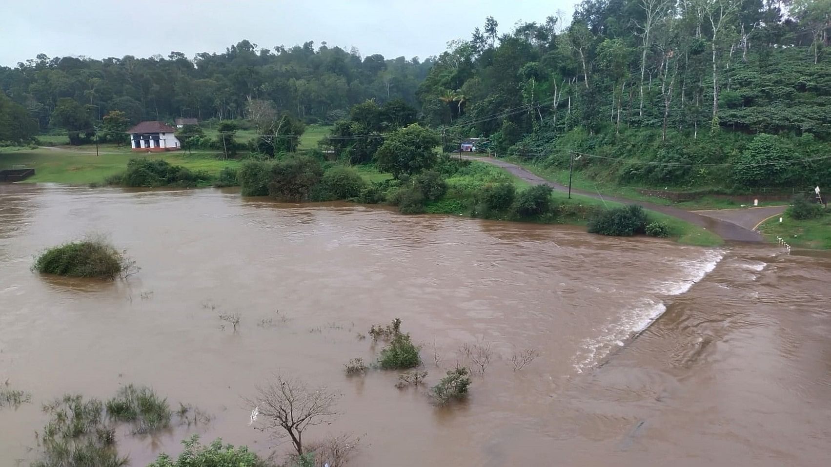 A minor bridge submerged following heavy rainfall at Balamuri in Napoklu hobli of Kodagu district.