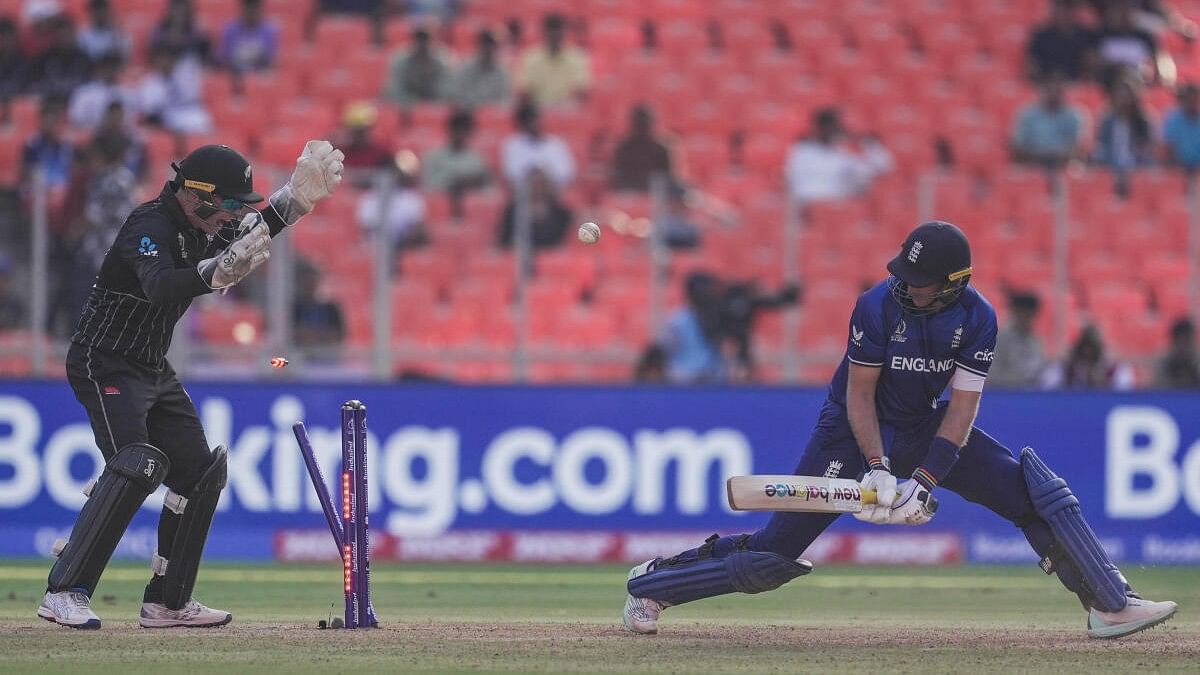 <div class="paragraphs"><p>England's batter Joe Root being bowled out by New Zealand's bowler Glenn Phillips during the ICC Men's Cricket World Cup 2023 match between England and New Zealand.</p></div>
