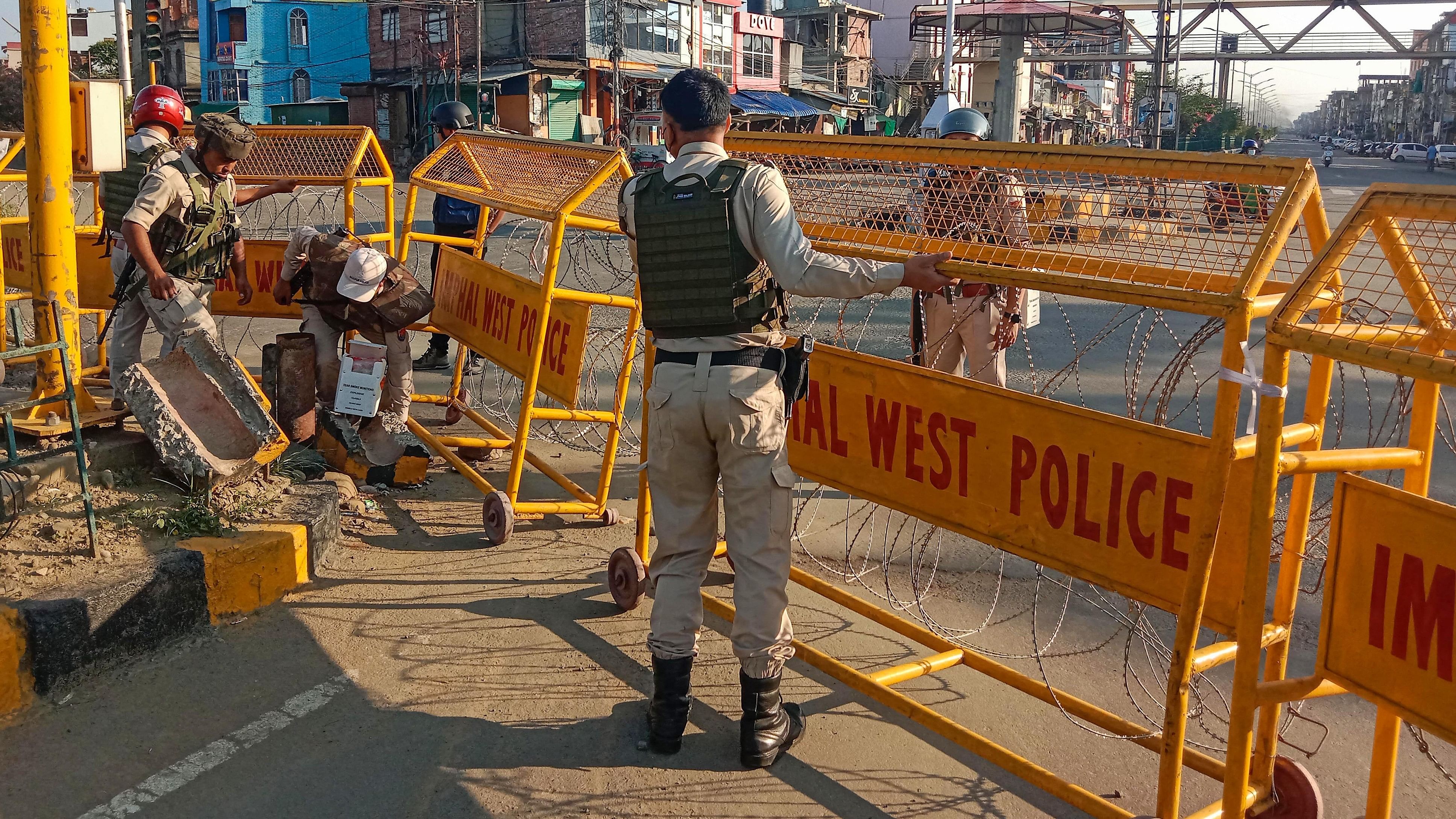 <div class="paragraphs"><p>Police personnel stand guard in a violence-hit area of Imphal town.&nbsp;</p></div>