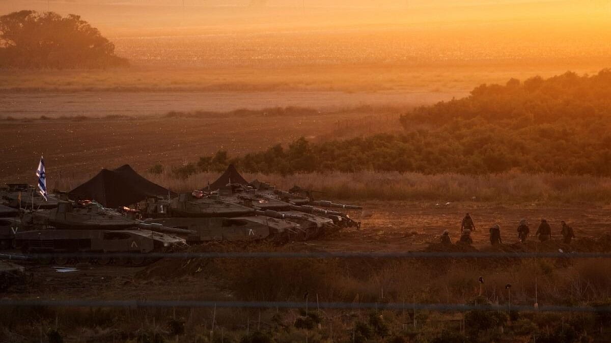 <div class="paragraphs"><p>A formation of Israeli tanks is positioned near Israel's border with the Gaza Strip, in southern Israel October 21, 2023.</p></div>