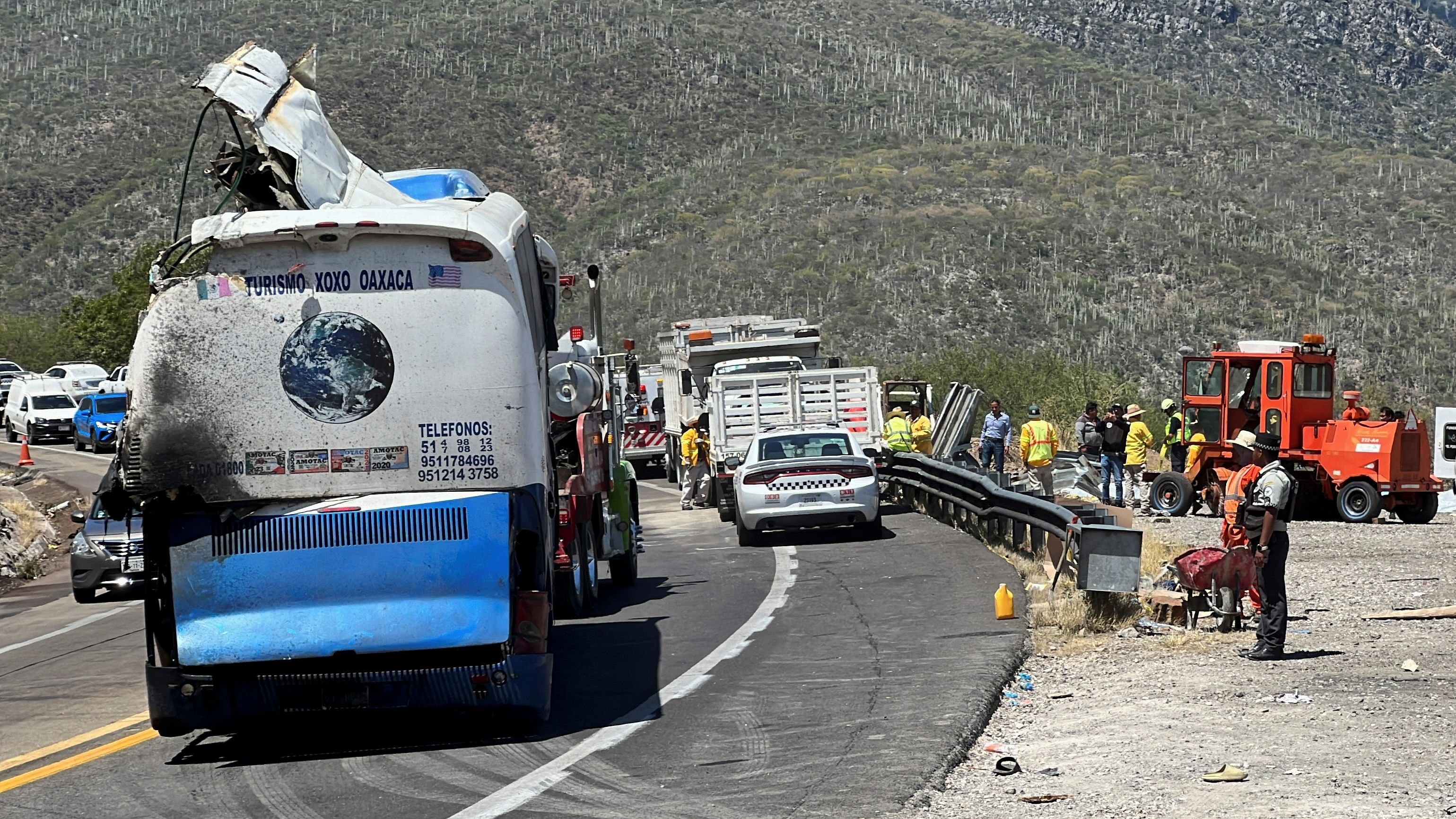 <div class="paragraphs"><p>A tow truck moves a bus, on the scene of a road accident, after a bus carrying dozens of mostly Venezuelan migrants crashed, which left some of the passengers dead and wounded others, on the highway near Tepelmeme Villa de Morelos, in the southern state of Oaxaca, Mexico October 6, 2023. </p></div>
