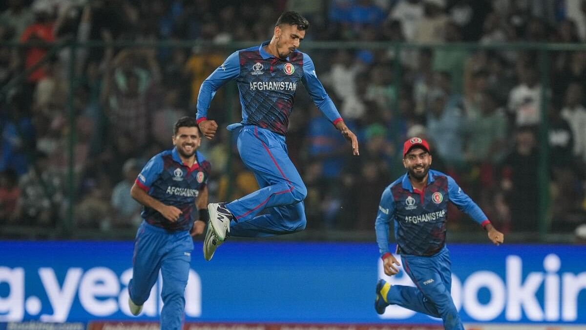 <div class="paragraphs"><p>Afghanistan's Mujeeb Ur Rahman with teamamtes celebrates the wicket of England's Chris Woakes during the ICC world cup.&nbsp;</p></div>