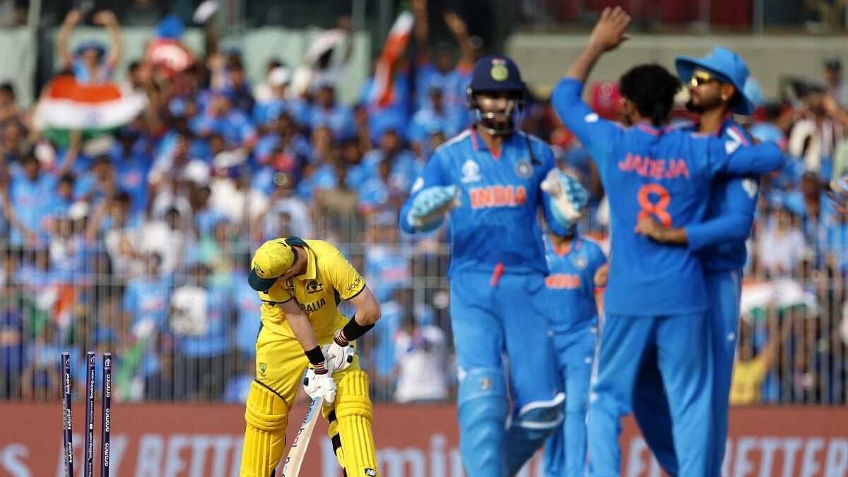 <div class="paragraphs"><p>Ravindra Jadeja celebrates with teammates after bowling out Australia's Steve Smith.</p></div>