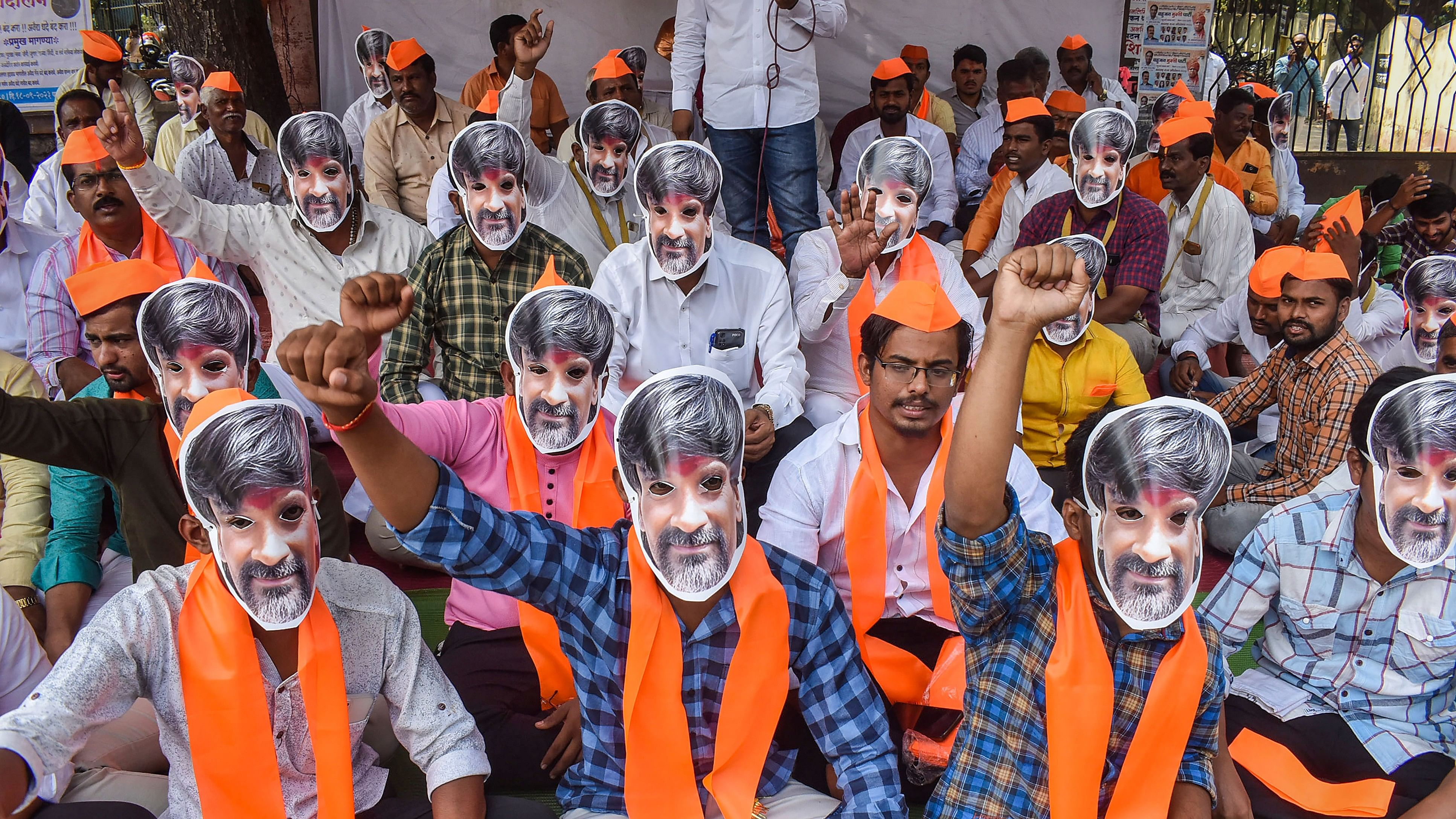 <div class="paragraphs"><p>Sakal Maratha Samaj activists wearing mask of activist Manoj Jarange-Patil participate in a hunger strike to press for Maratha reservation, in Solapur, Monday, Oct. 30, 2023.</p></div>