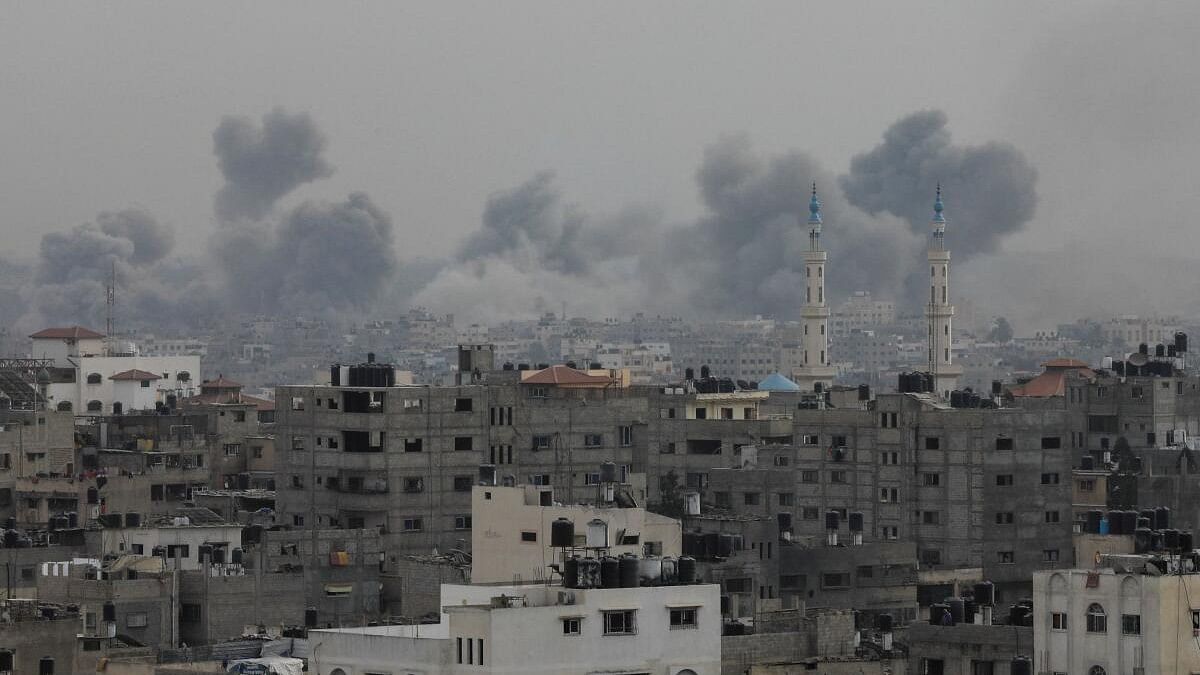 <div class="paragraphs"><p>Plumes of smoke rise during Israeli strikes, amid the ongoing conflict between Israel and Palestinian Islamist group Hamas, in Gaza City.</p></div>