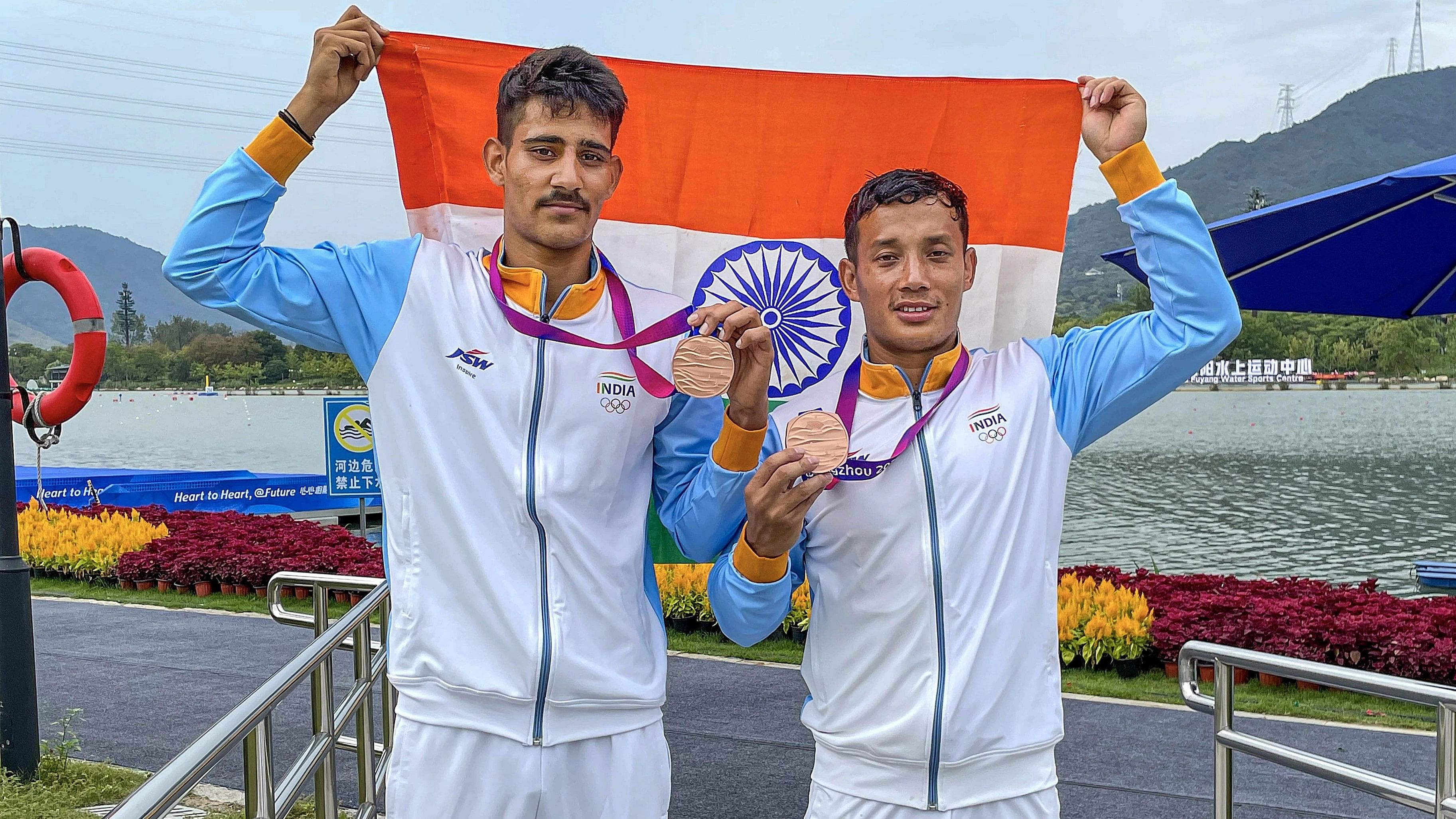 <div class="paragraphs"><p>Arjun Singh and Sunil Singh Salam pose for photos after winning the bronze medal in the final of Men's Double 1000m canoe event at the 19th Asian Games in Hangzhou.</p></div>