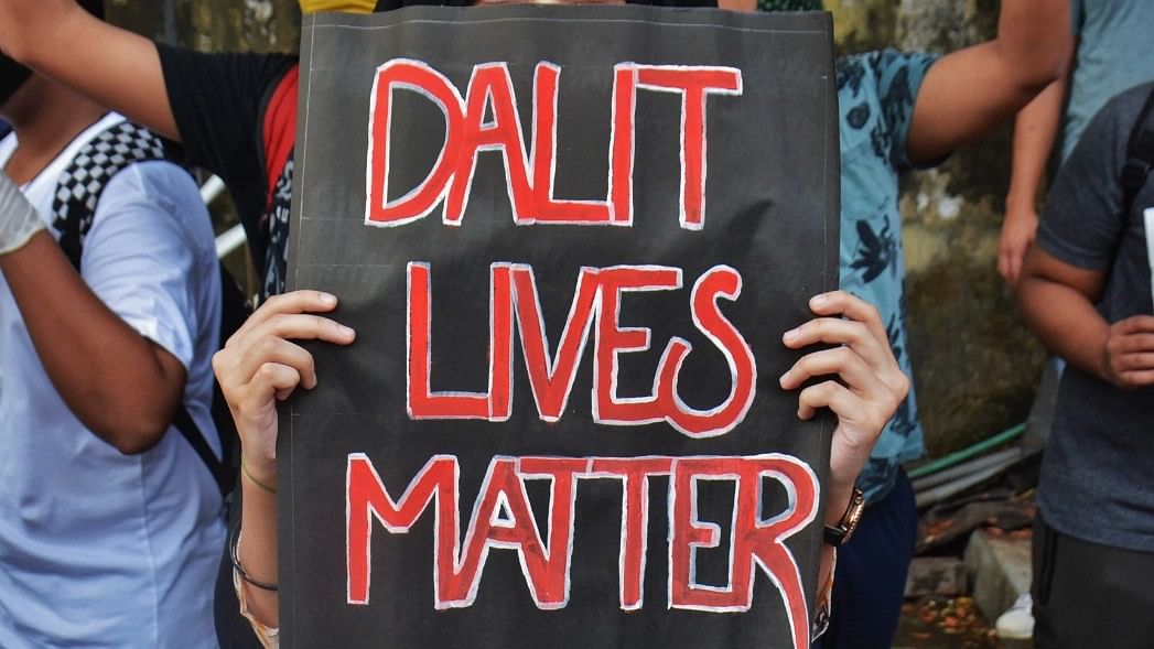 <div class="paragraphs"><p>Representative image showing a woman holding a banner of 'Dalit lives matter'.</p></div>
