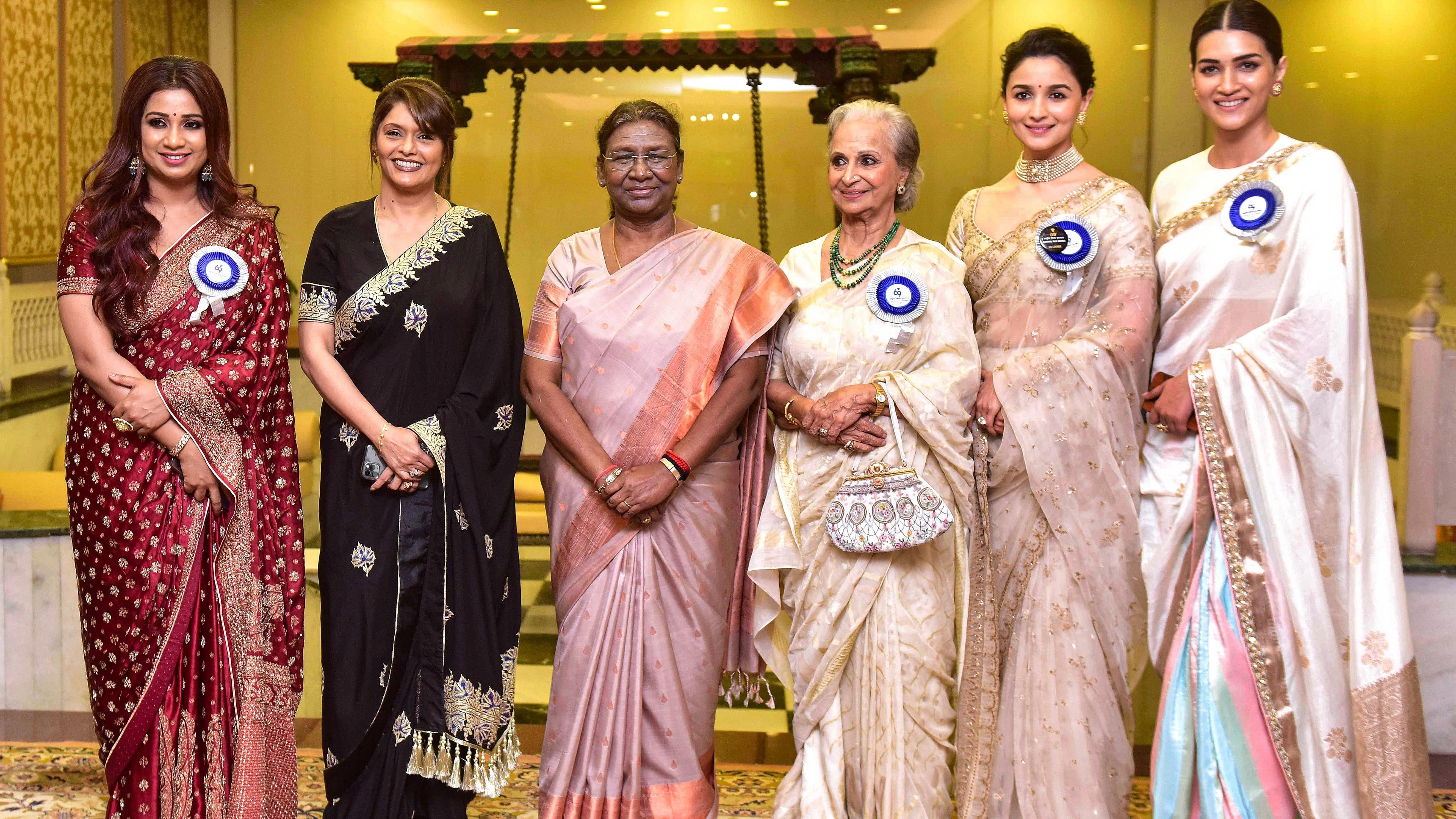 <div class="paragraphs"><p>President Droupadi Murmu with Dadasaheb Phalke Awardee Waheeda Rehman (3R), Best Actresses Alia Bhatt (2R) and Kriti Sanon (R), Best Supporting Actress Pallavi Joshi (2L) and Best Playback Singer Female Shreya Ghoshal (L) poses for group photos during the 69th National Film Awards ceremony at Vigyan Bhavan, in New Delhi, Tuesday, </p></div>