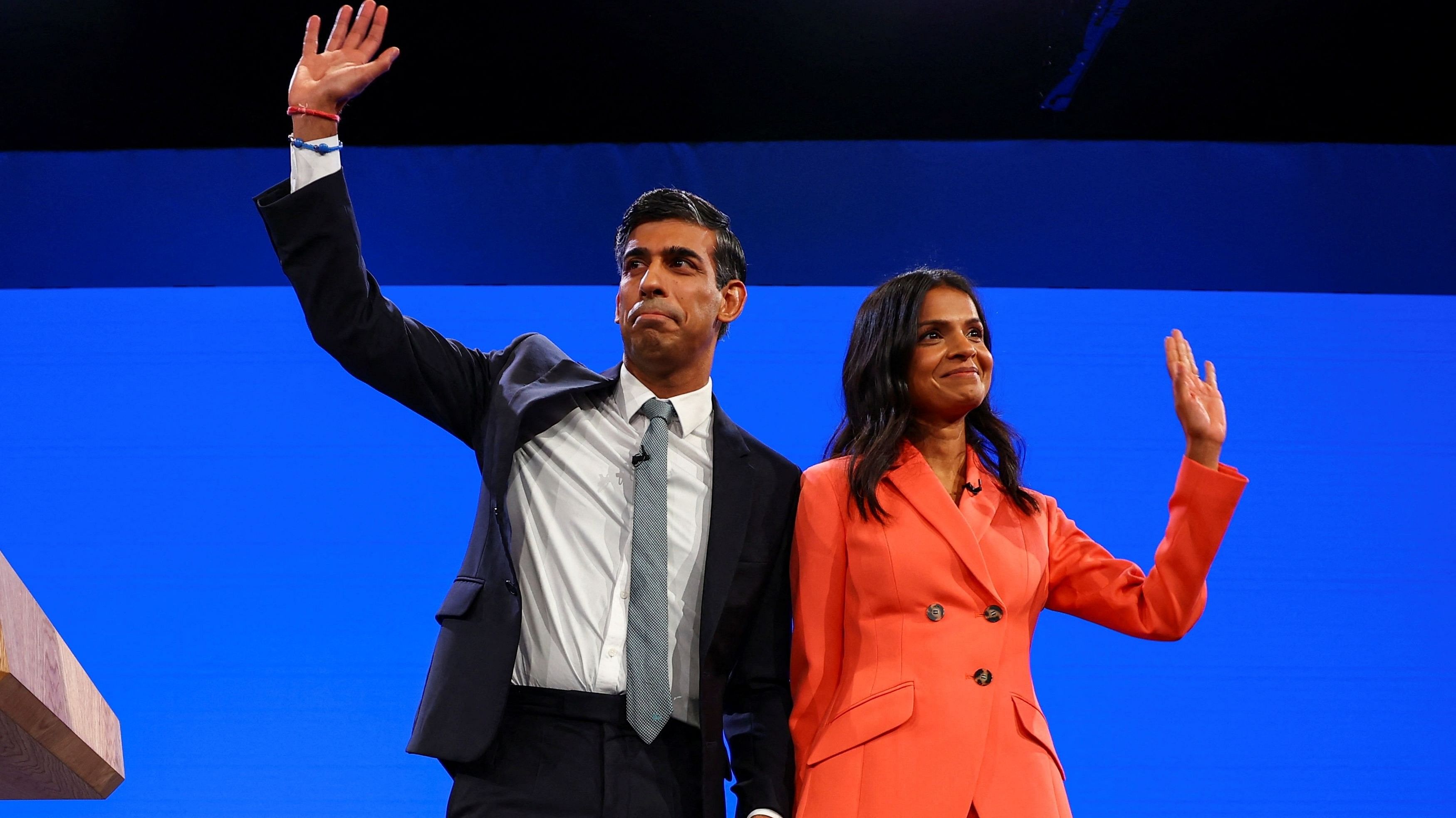 <div class="paragraphs"><p>British Prime Minister Rishi Sunak and his wife Akshata Murty greet people on stage, at Britain's Conservative Party's annual conference in Manchester.</p></div>